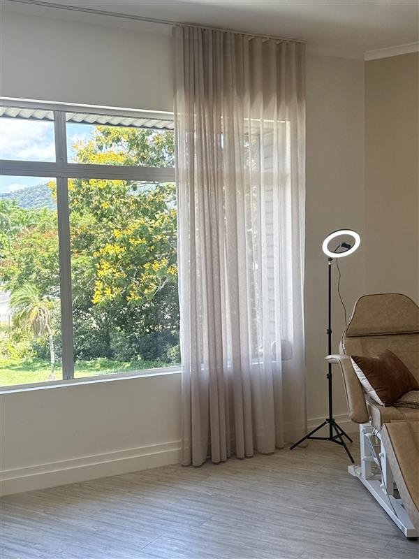 Photo of salon with beauty chair and window looking outside