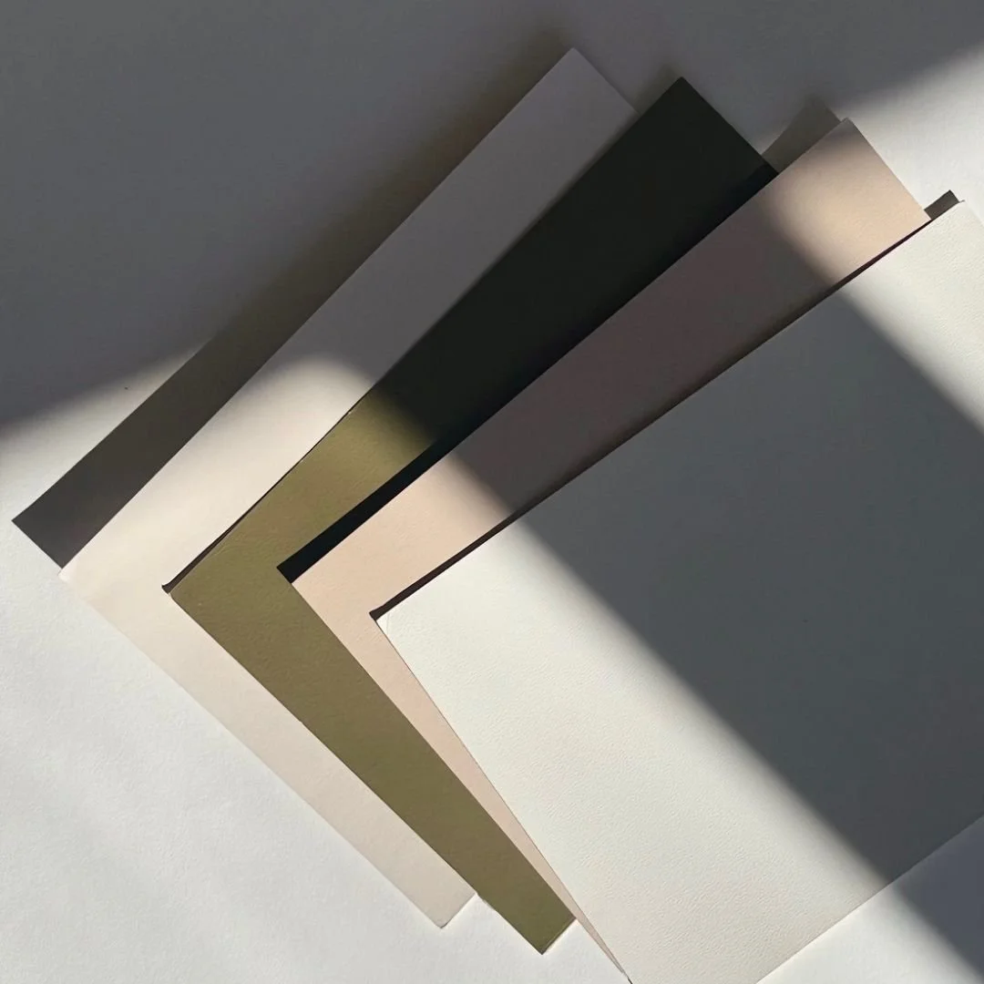 Paint samples arranged on white table