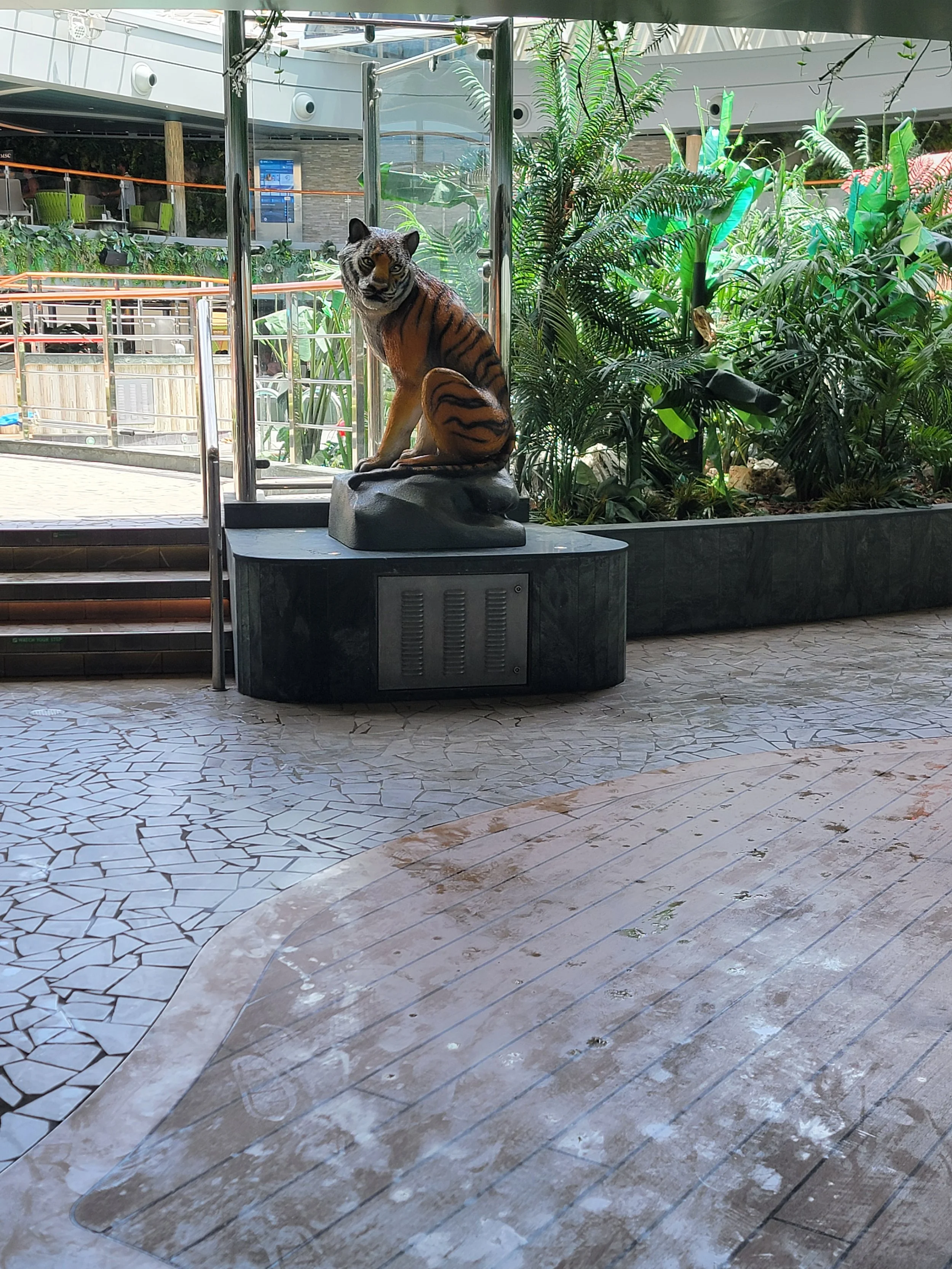 Tiger statue in pool area of a cruise ship