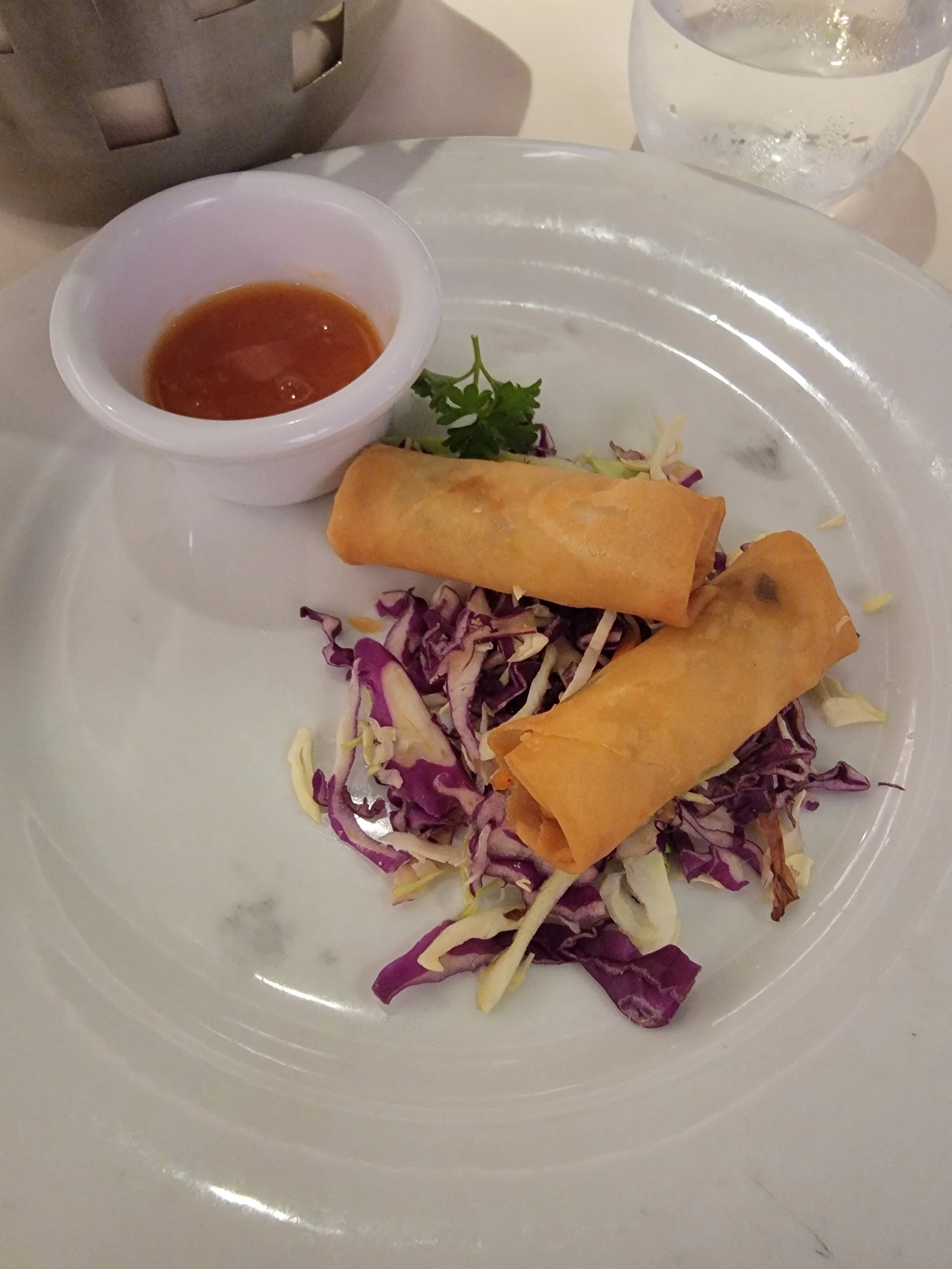 Spring rolls on a bed of cabbage