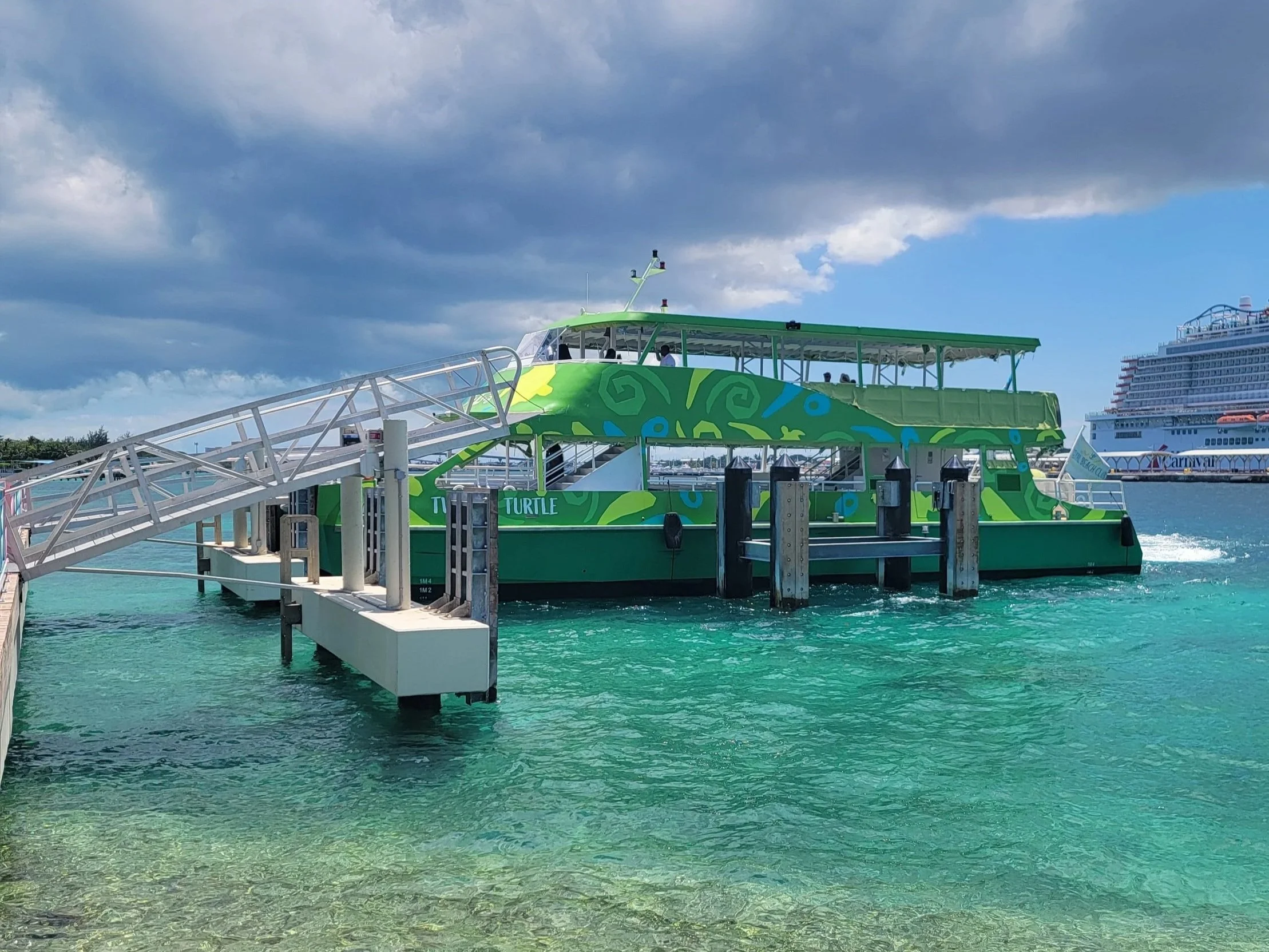 Bright green ferry at Royal Caribbean's Paradise Island Beach Club