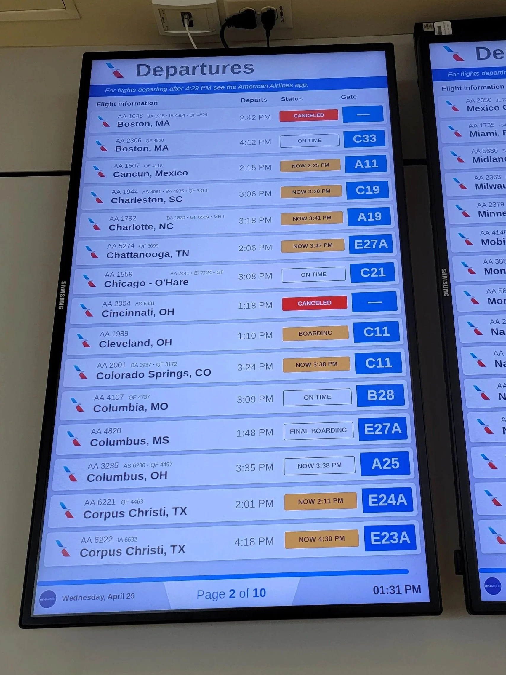 airport departure board showing delayed and cancelled flights