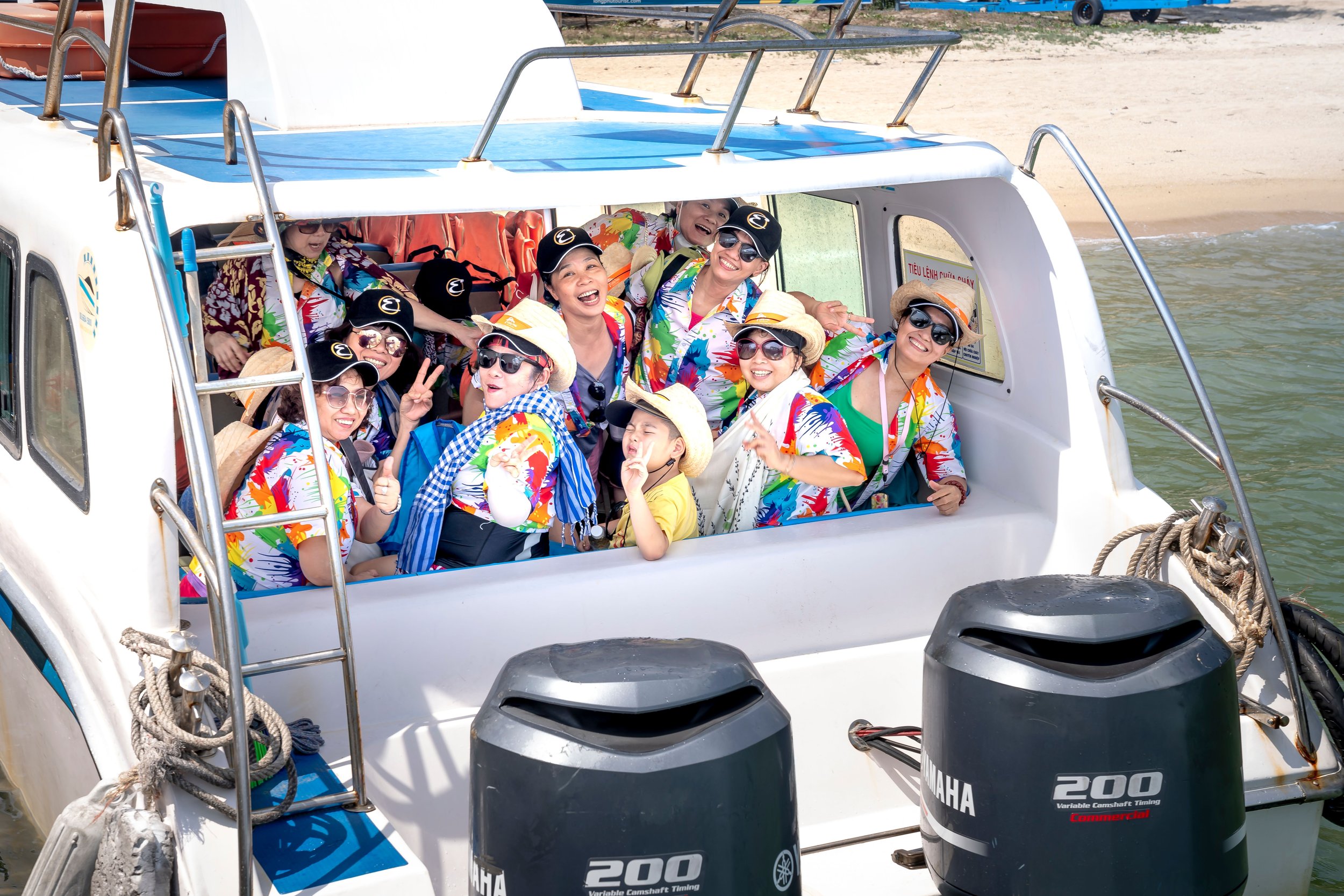 large family looking out of back of boat