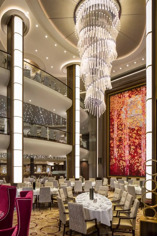 Symphony of the Seas three story main dining room with grand spiral chandelier