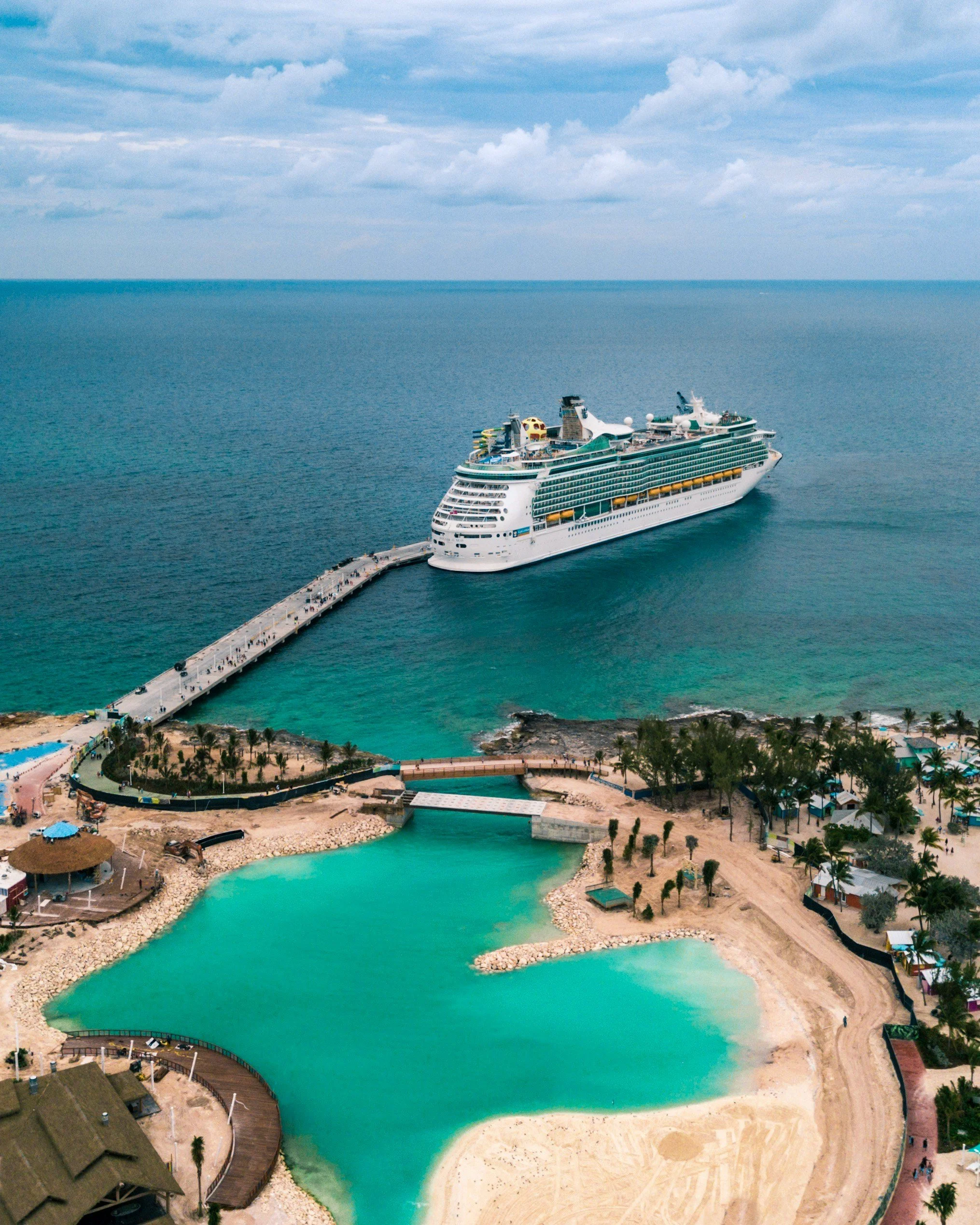 cruise ship docked at caribbean island