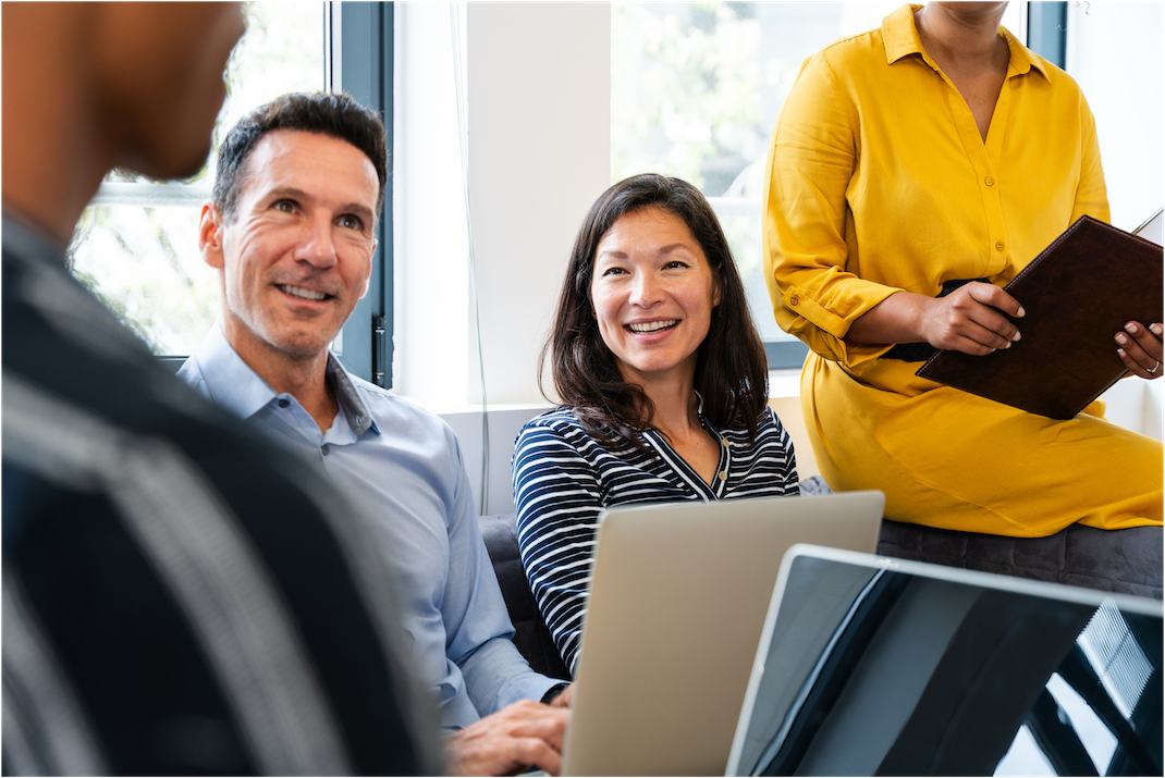 Close up photo of people working in a small group during a training session