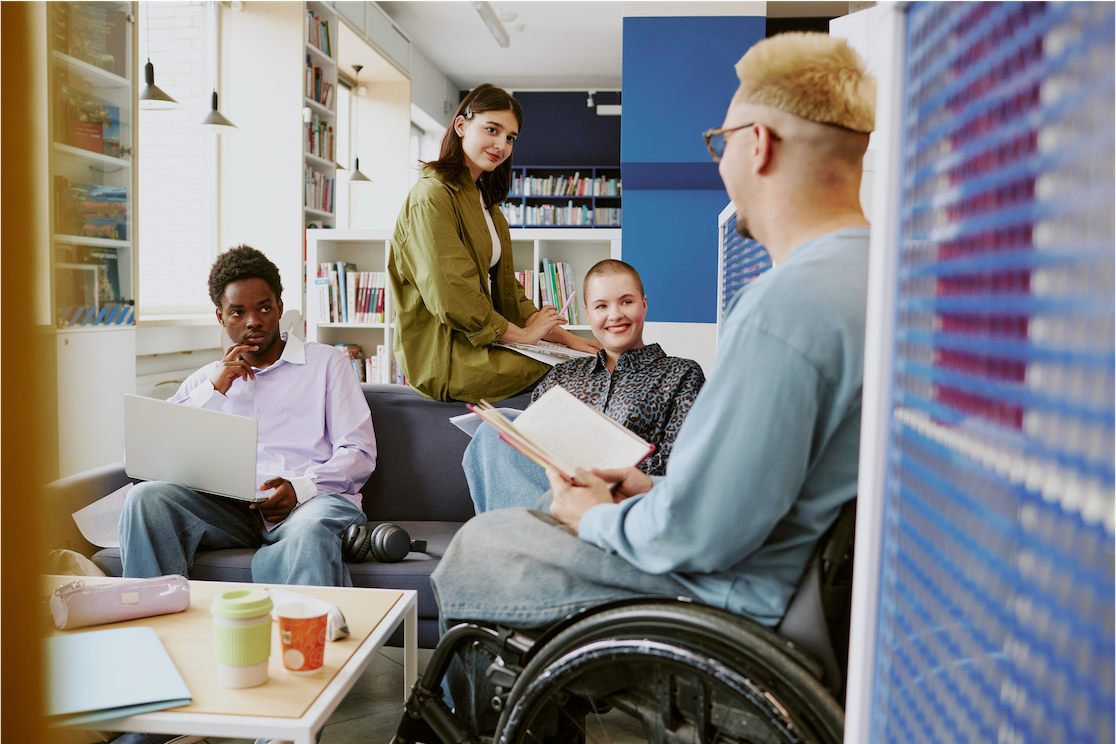 Photo of four colleagues seated in an informal office setting