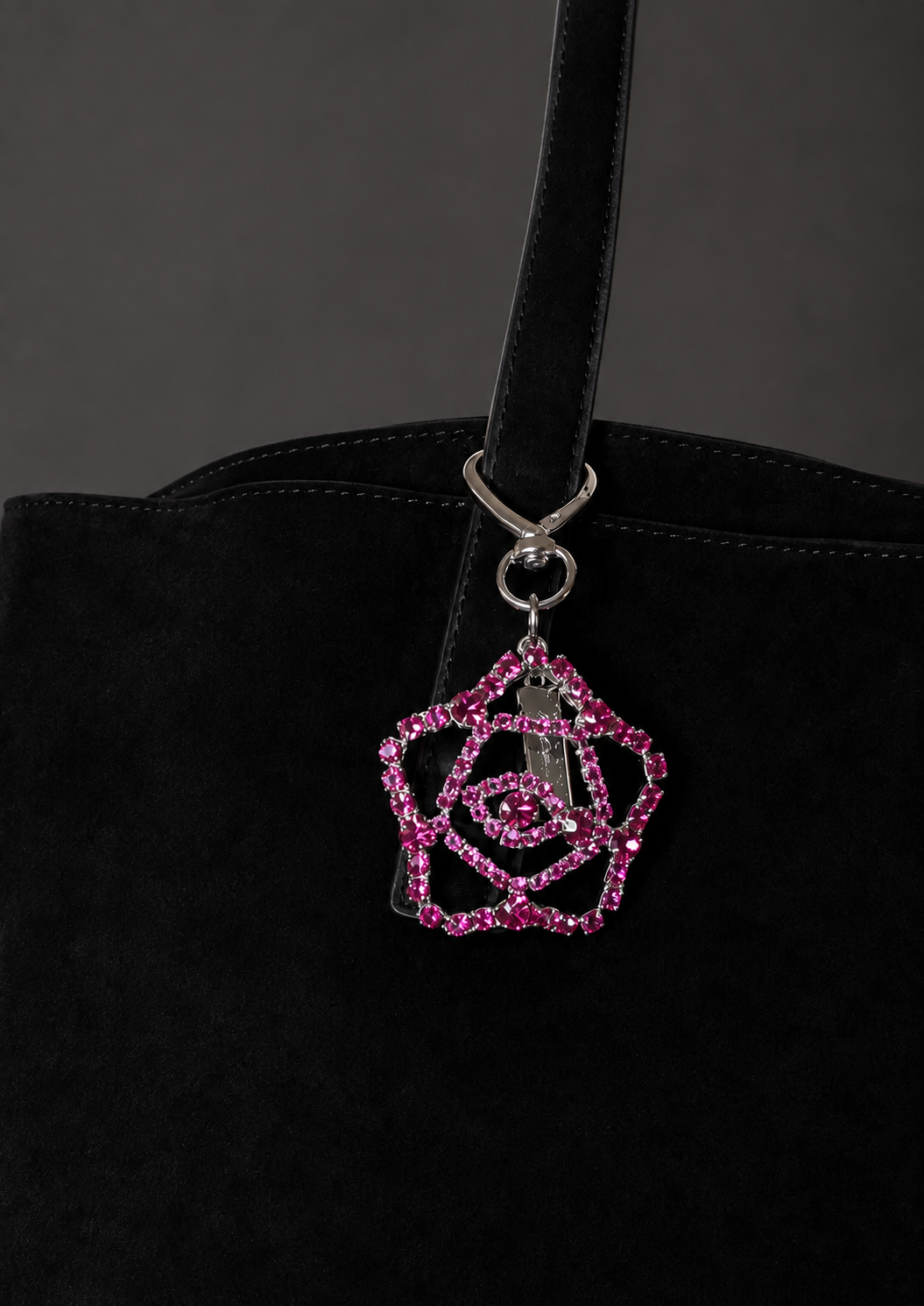 BAG CHARM 1 FUCHSIA ON BAG 1.png