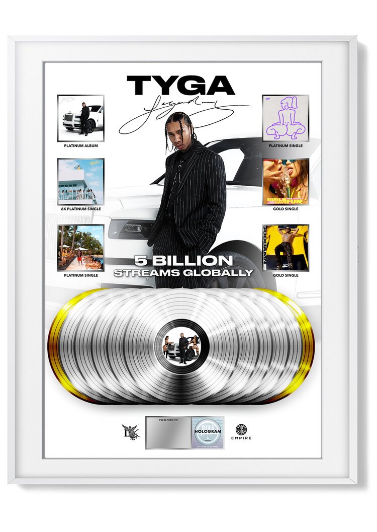 Framed award plaque for music artist Tyga, celebrating 5 billion global streams, featuring platinum and gold singles and albums, with artist image and logos of record companies.