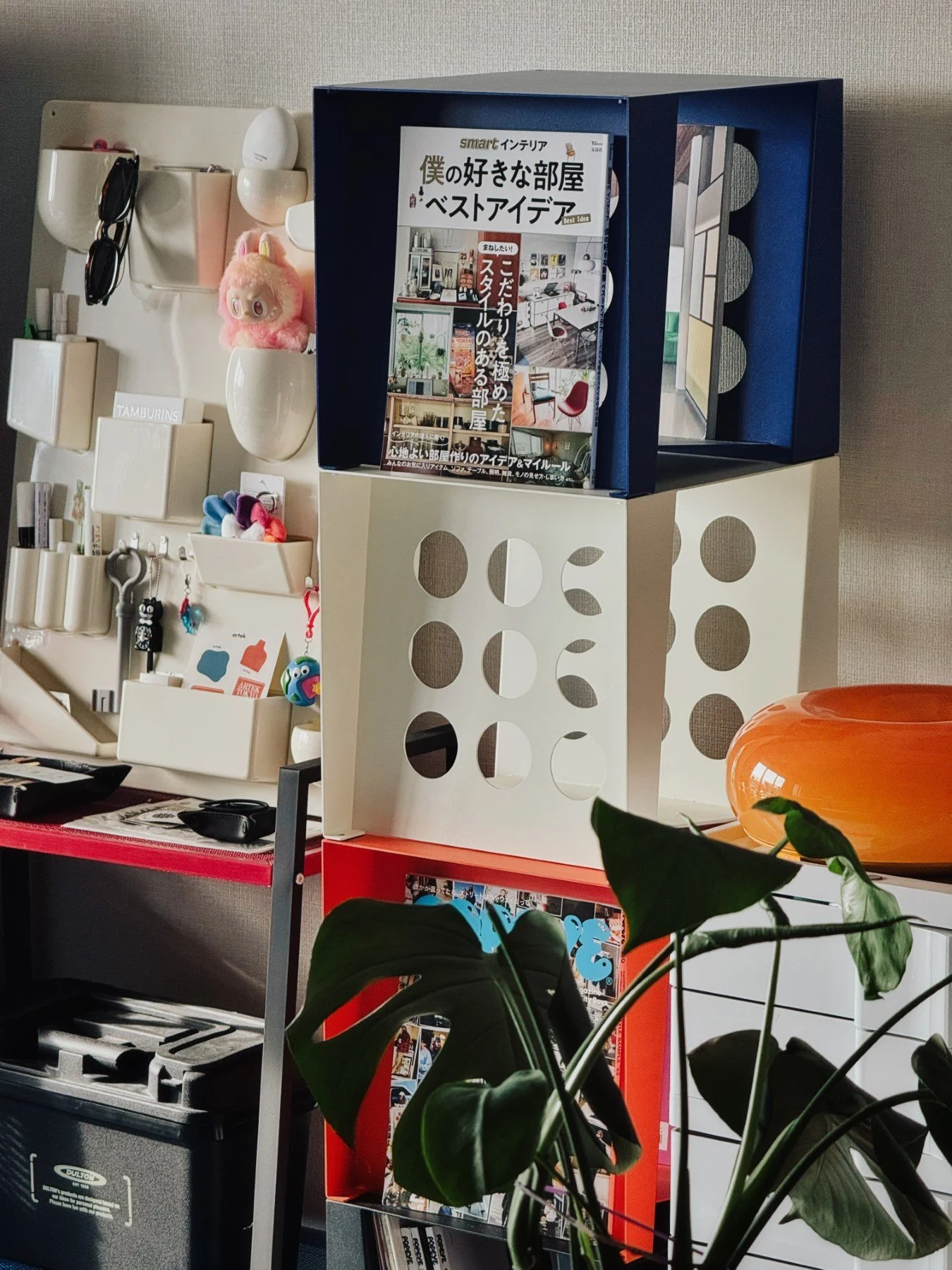 Stacked Tilted Book Seats forming a corner statement furniture, showcasing magazine covers like a gallery.