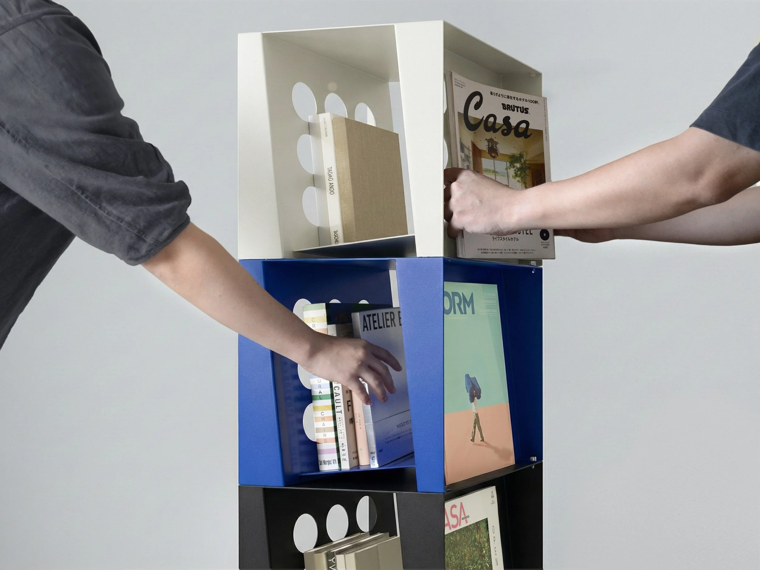 Stacked Tilted Book Seat units holding books upright and displaying magazines covers like a gallery.