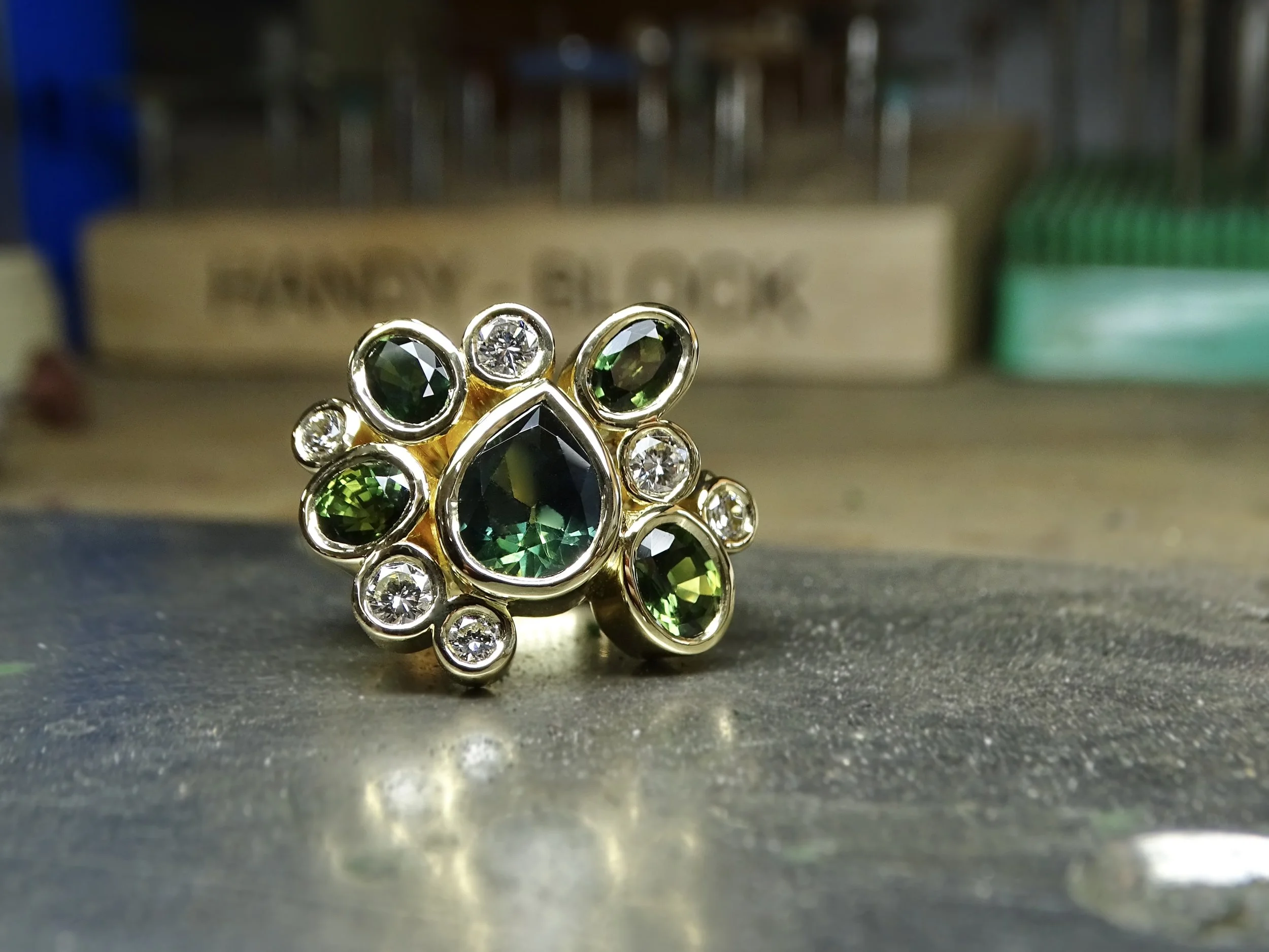 18ct yellow gold bezel set Australian parti sapphire ring. 