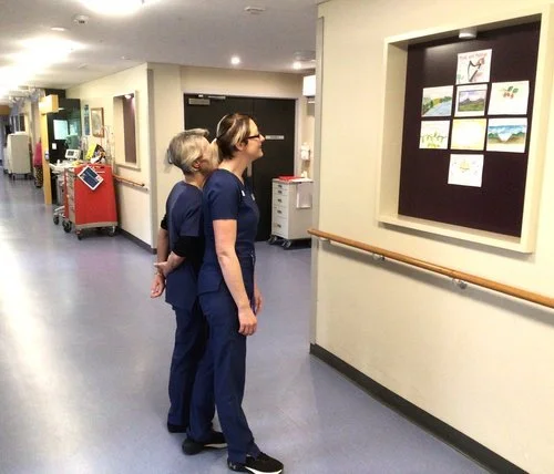 nurses+looking+at+artwork.jpeg