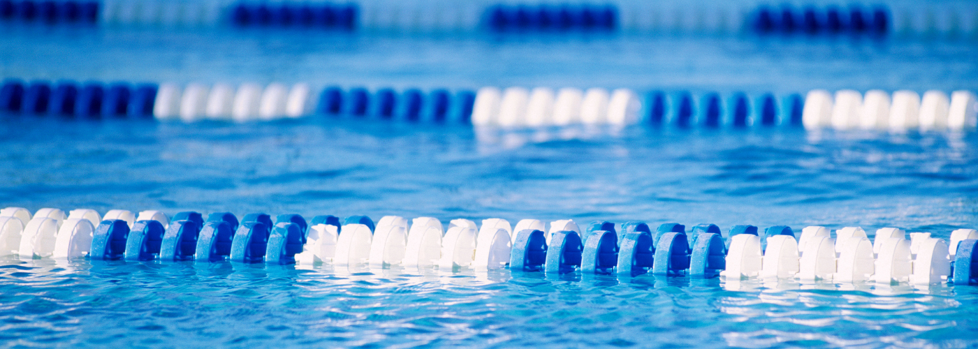 Close-up of blue and white floating lane dividers in a swimming pool