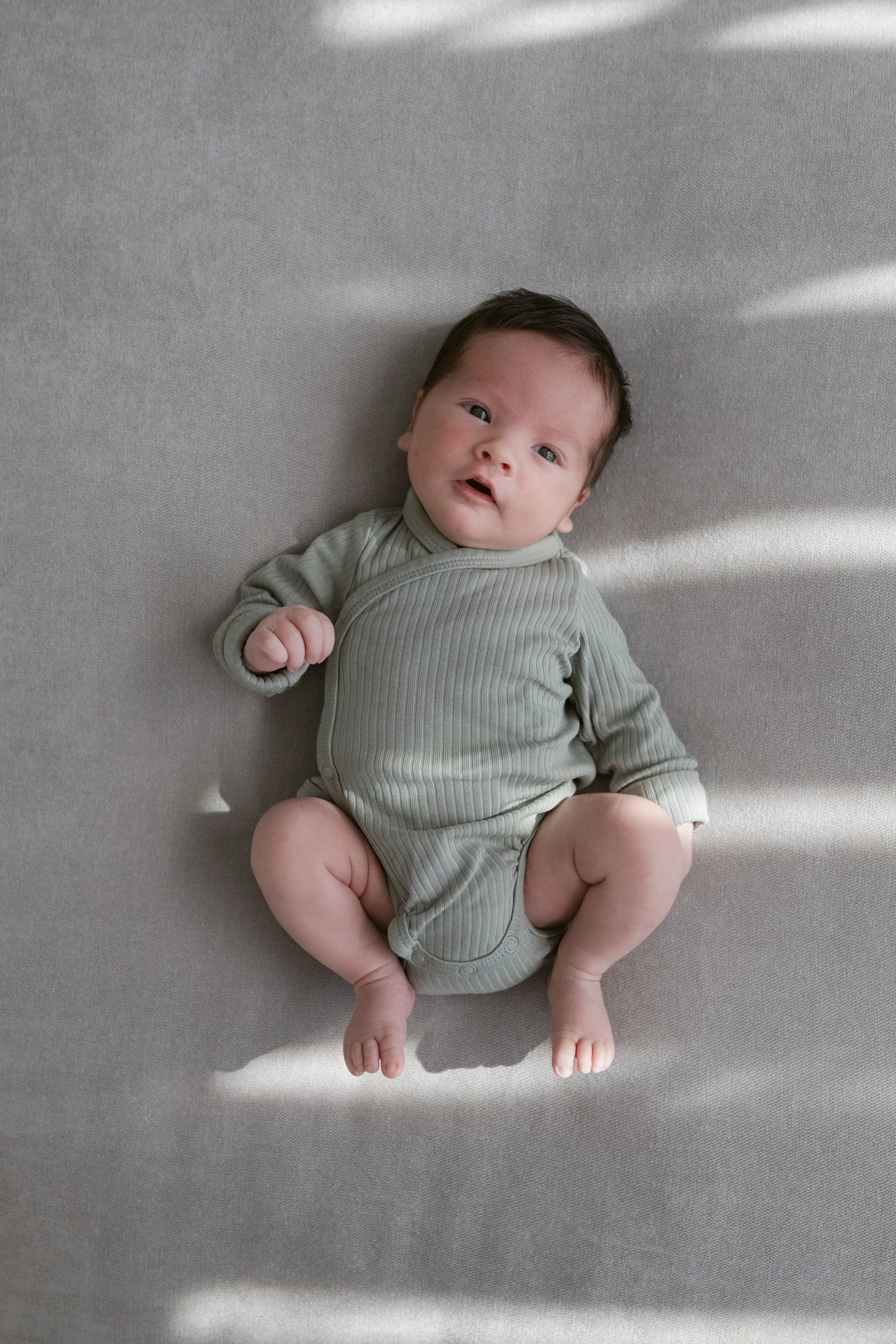 Newborn baby portrait photographed in natural light during an in-home session in Dubai