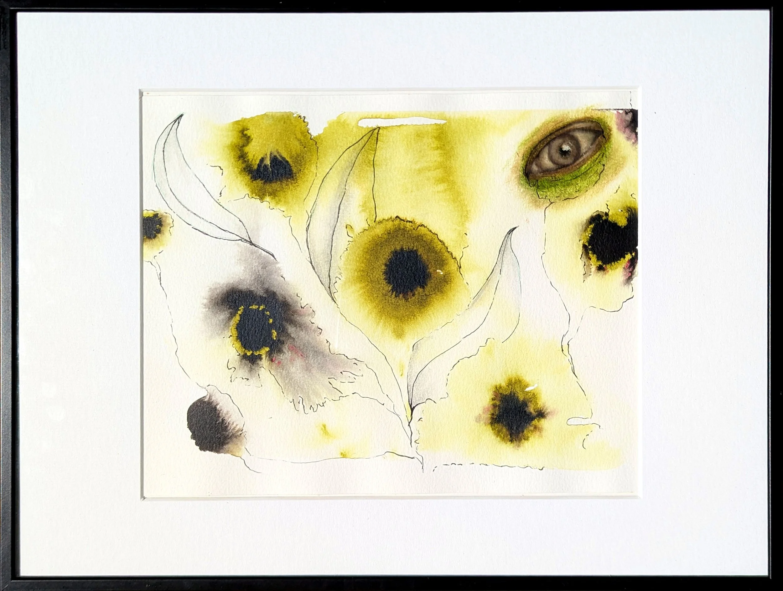 Framed surreal mixed media artwork combining spontaneous yellow watercolor floral blooms, delicate ink outlines of leaves, and a realistic human eye woven into the composition