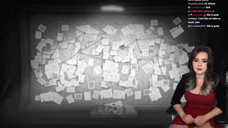 Twitch streamer 'Stormfall33' with long dark hair, wearing a red dress and black cardigan, reacting to the Galaxies Showcase on Twitch, with a chat overlay on top.