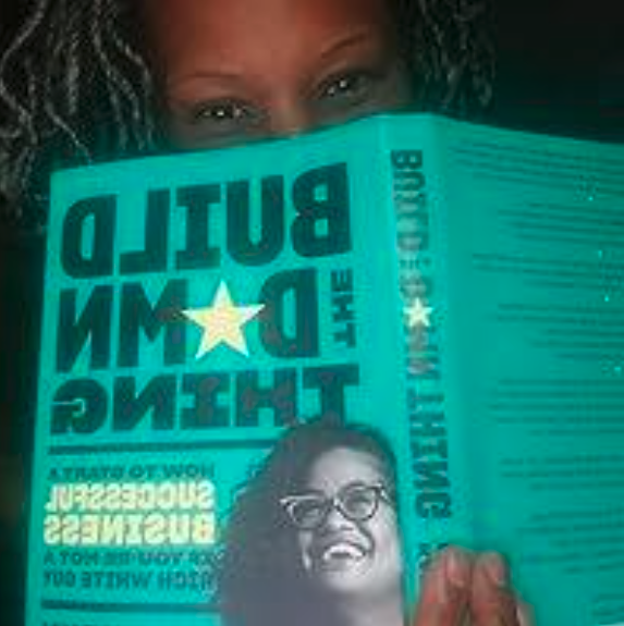 Person holding a book titled 'The Bold and The Thriving' by Sherri Fitts, partially covering their face, revealing only their eyes.
