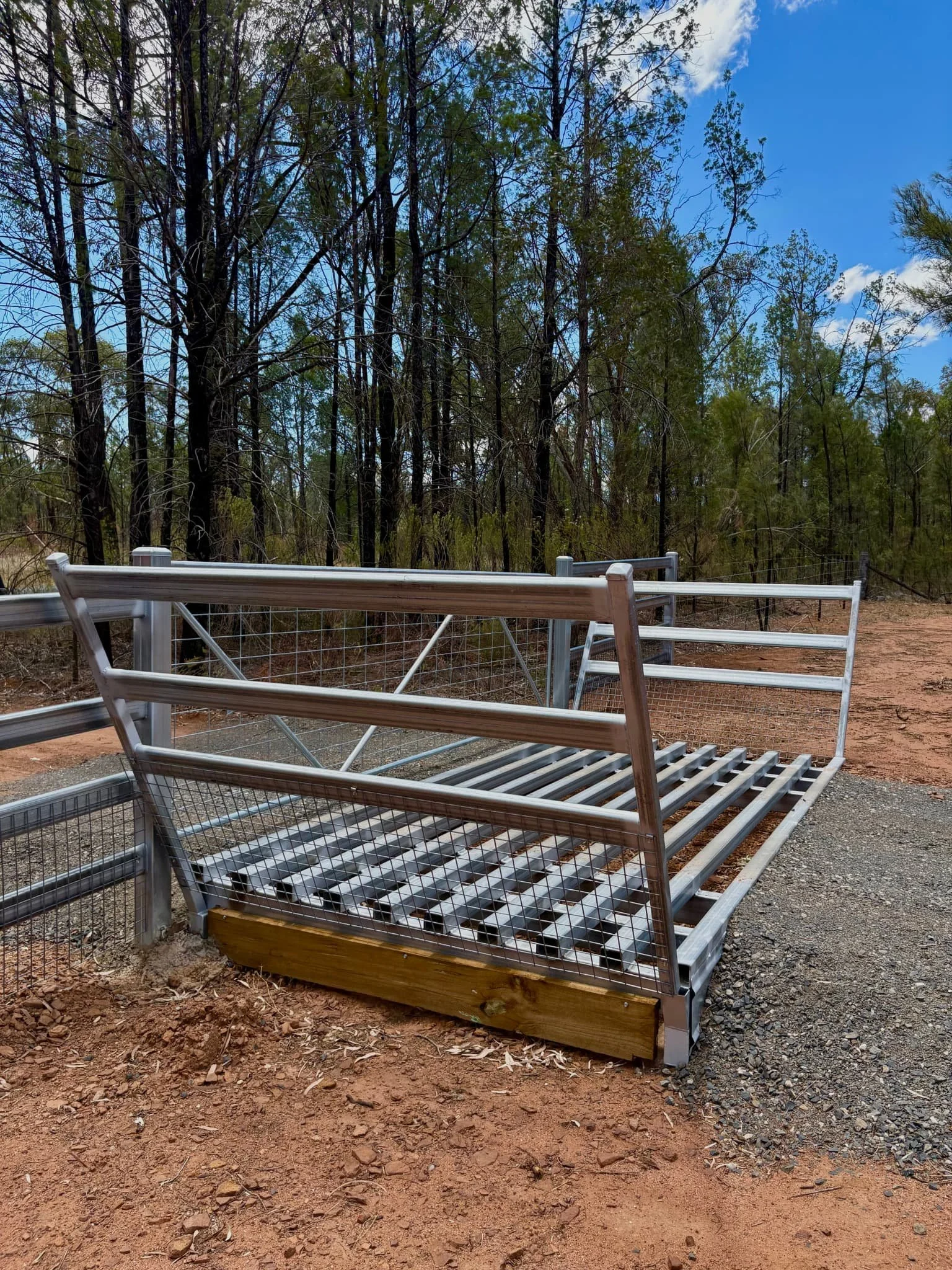 Close-up of cattle grid and side rail installation, rural fencing contractors Northern Rivers NSW
