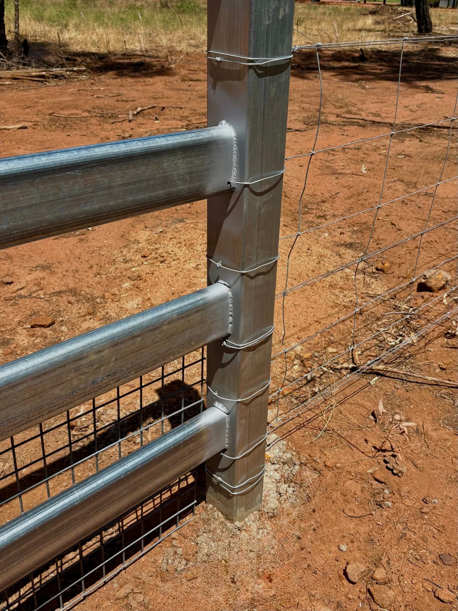 Welded cattle rail and post detail, agricultural fencing installation NSW