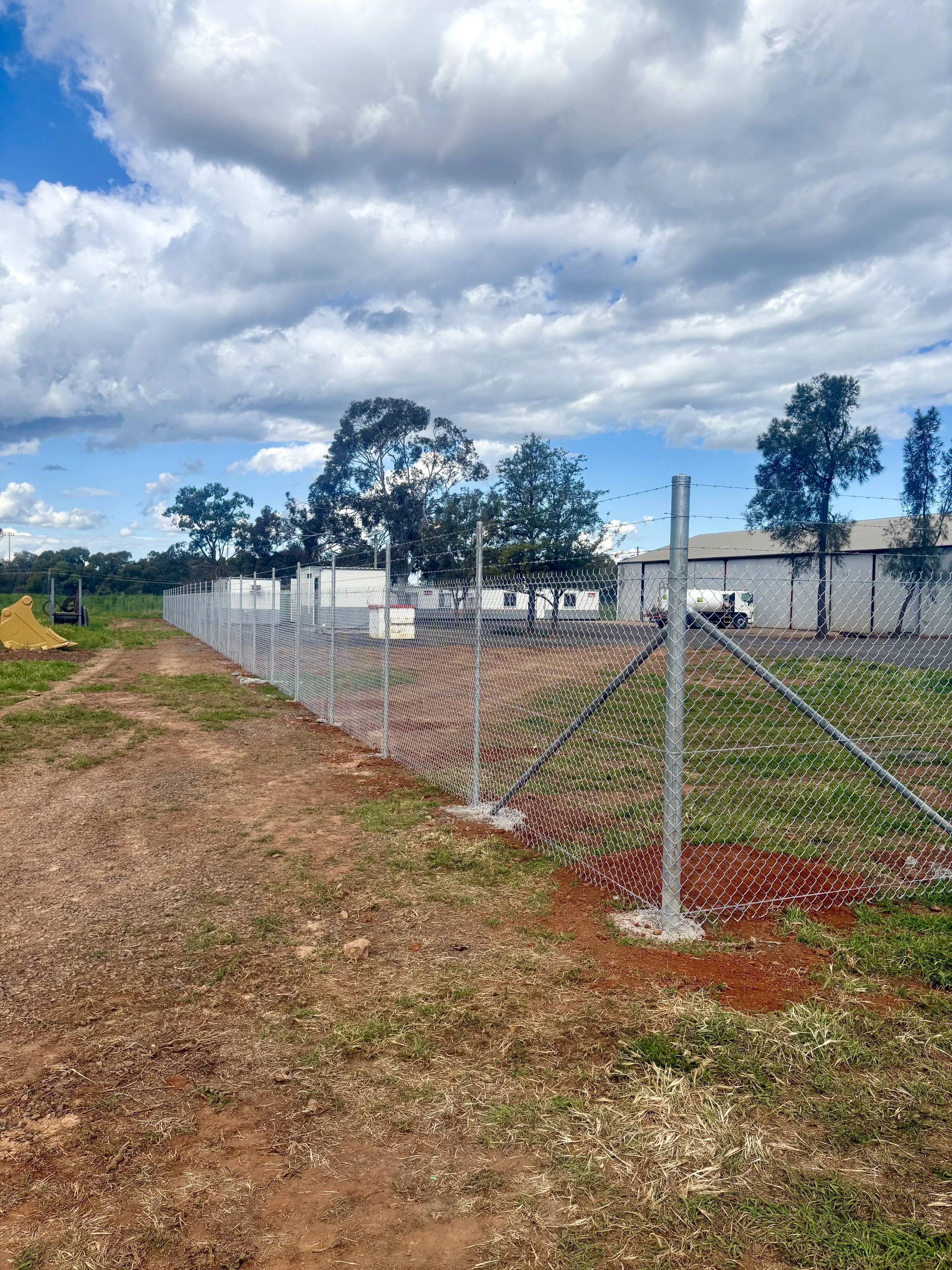 Corner view of compound security fence installed by TG Wheeler Contracting
