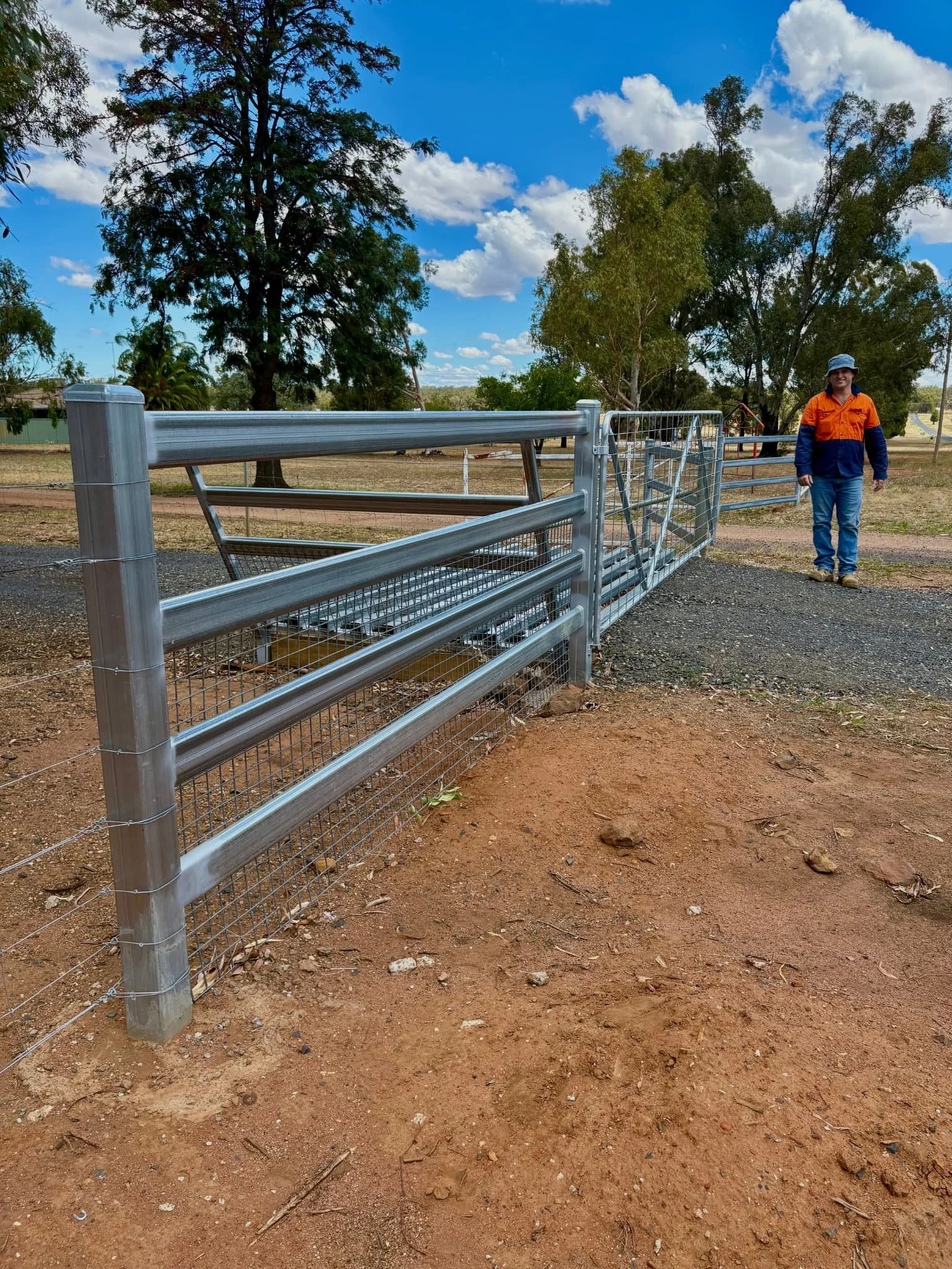 Galvanised cattle rail and front gate entry installed on rural property, rural fencing contractors Northern Rivers NSW
