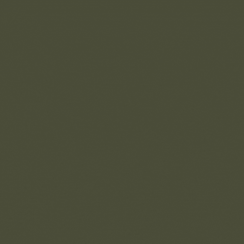 A clear plastic cup filled with ice and a dark carbonated beverage, possibly cola, placed on a white napkin on a table.