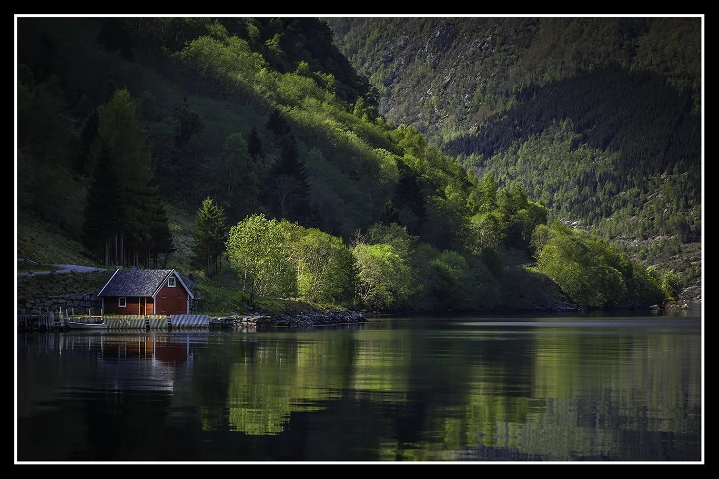 Red boat house by David Hawkins