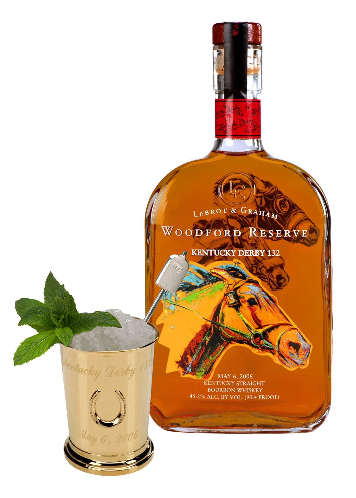 A bottle of Woodford Reserve Kentucky Derby 132 bourbon whiskey with a glass of crushed ice, mint leaves, and a $1,000 Mint Julep.