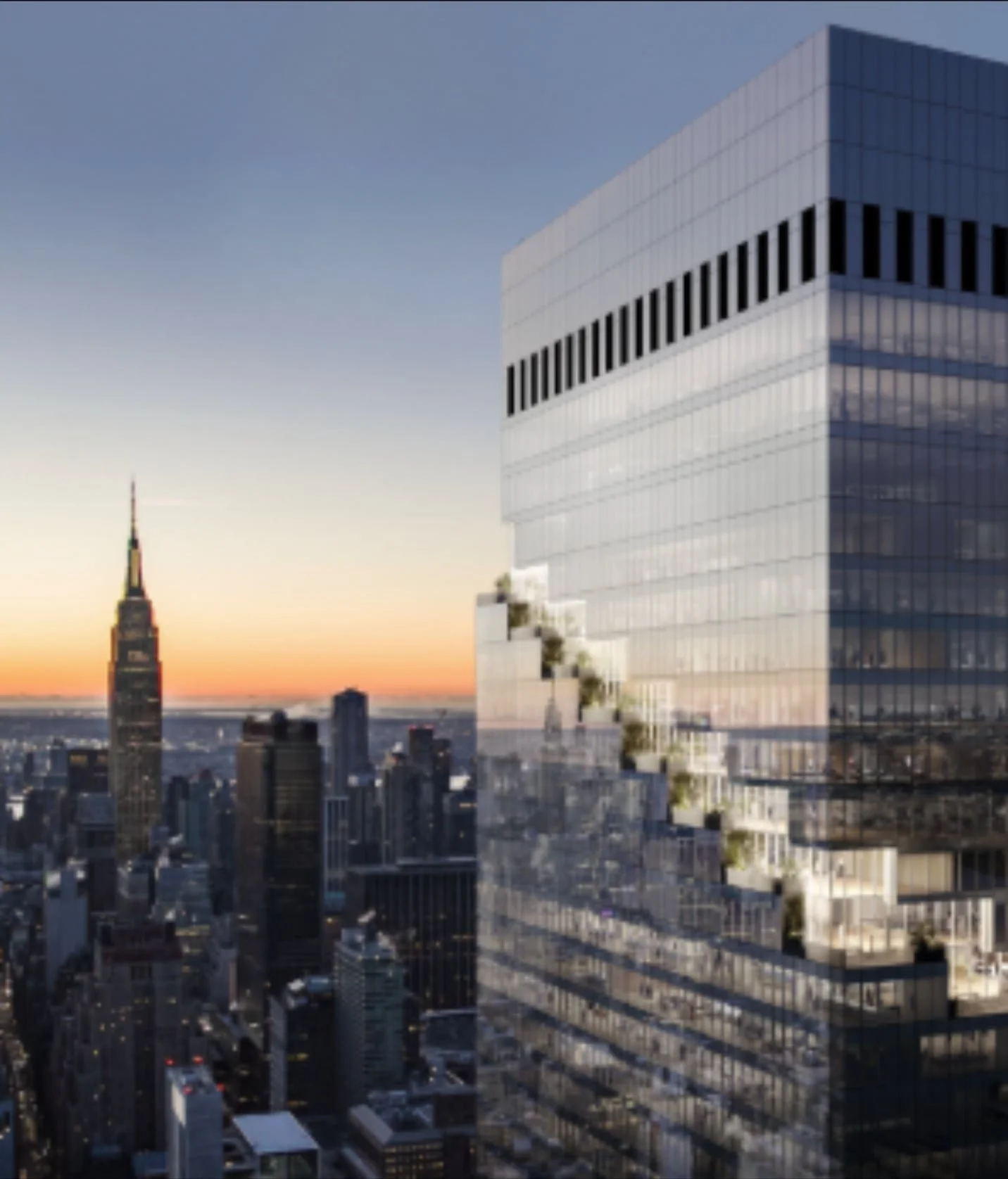Modern glass skyscraper with stepped terraces, city skyline, and Empire State Building at sunset in the background.