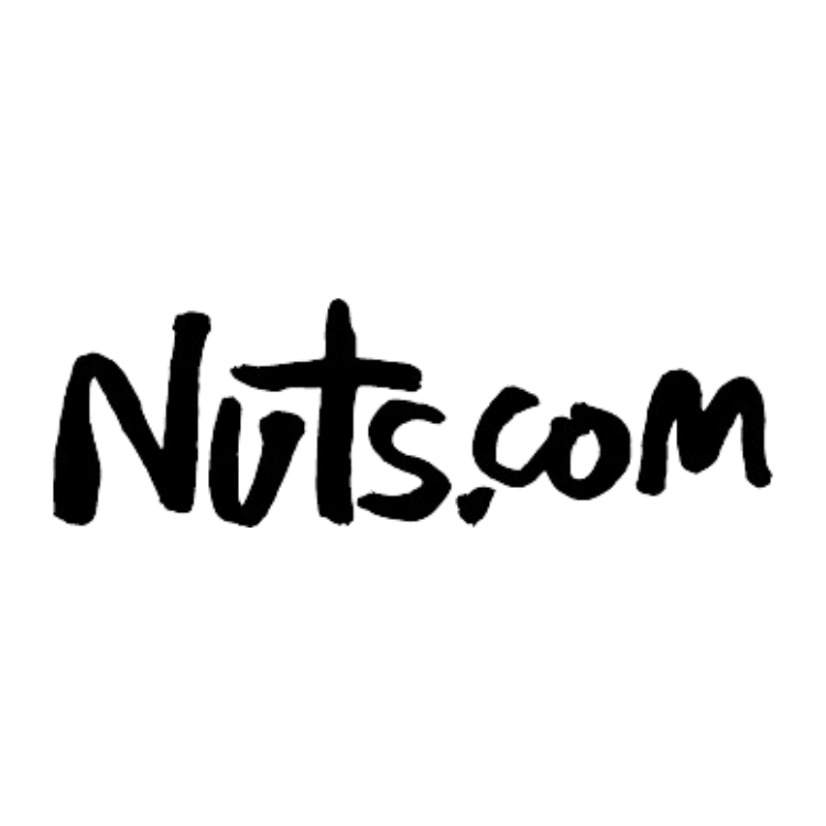 The logo of Nuts.com in black handwritten-style font with a cross integrated into the design.