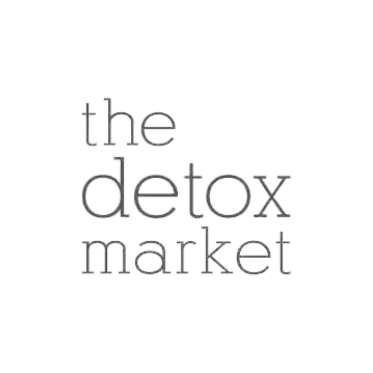 Gray text saying 'the detox market' with a blurred effect on a black background.