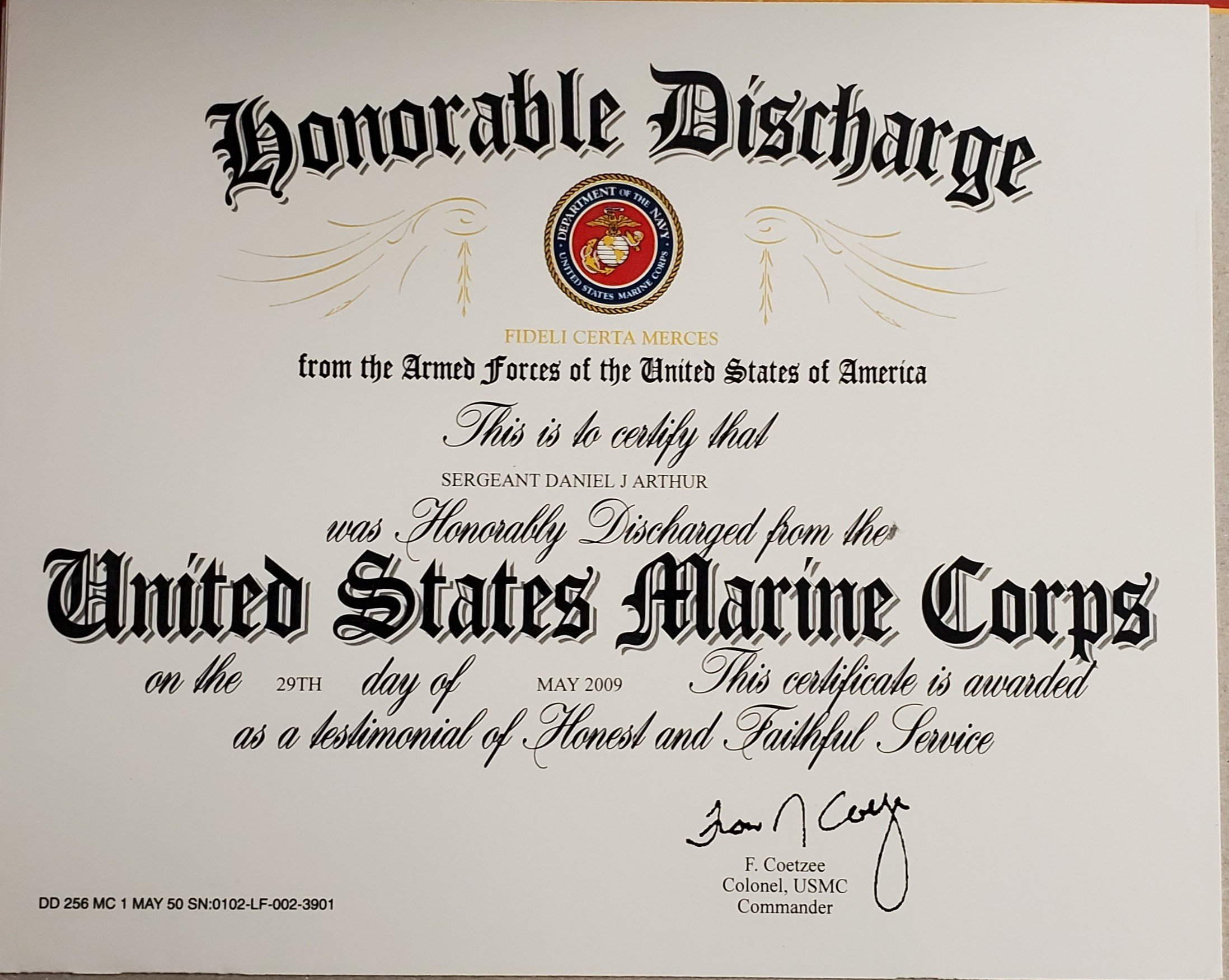 Certificate of honorable discharge from the United States Marine Corps awarded to Sergeant Daniel J. Arthur, signed by Colonel F. Coetzee, with official emblems and decorative text.