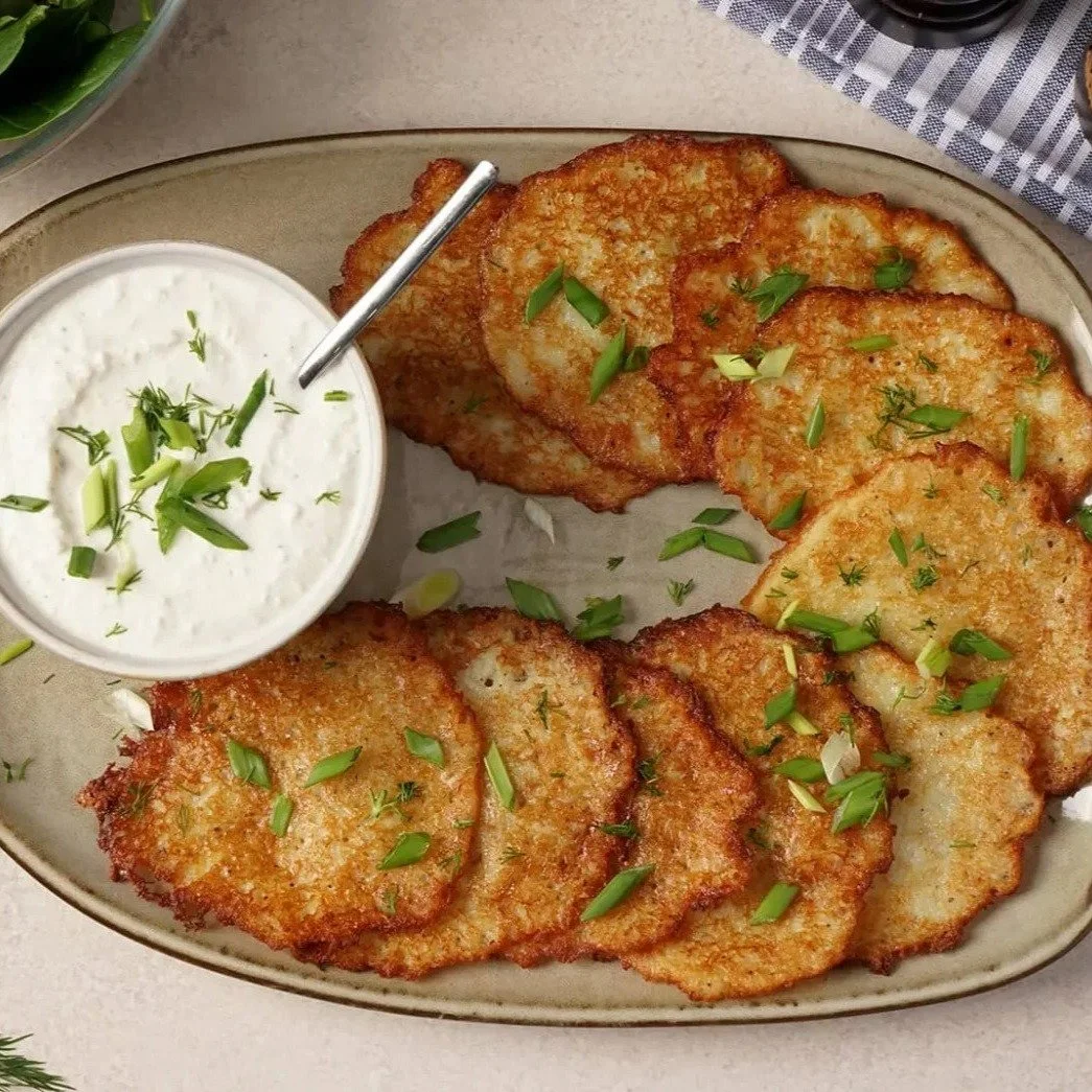 Bulviniai blynia ie potato pancakes with sour cream.. perfect wholesome food for the cold-weather #tourlithuania #potatopancakes