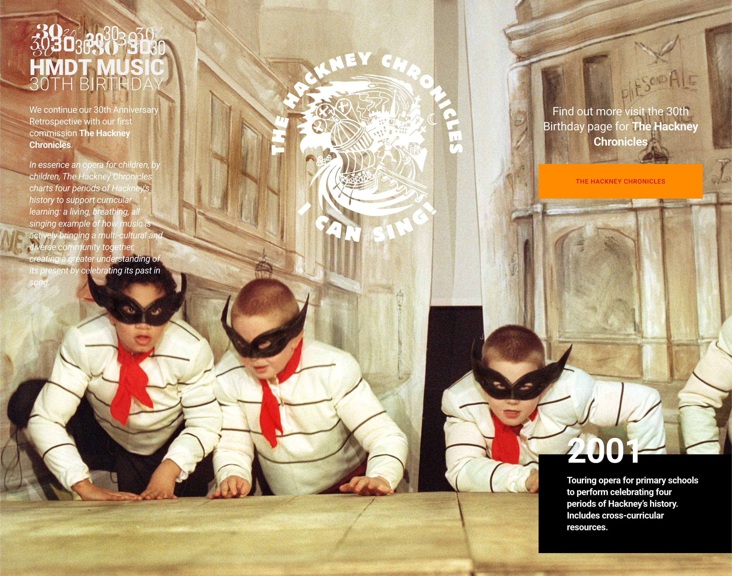 Children dressed as bandits with masks and striped shirts, sitting at a table.