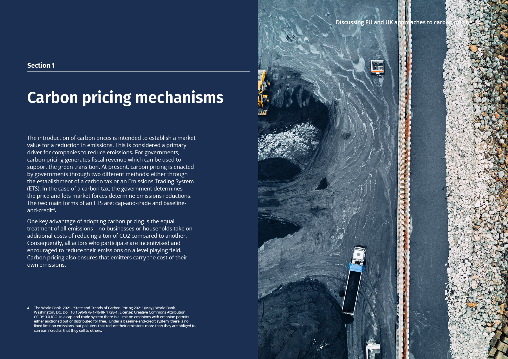 Text on a dark blue background discussing carbon pricing mechanisms, with an aerial photo of a quarry or mining site featuring trucks moving dark material, a water body, and a rock border.