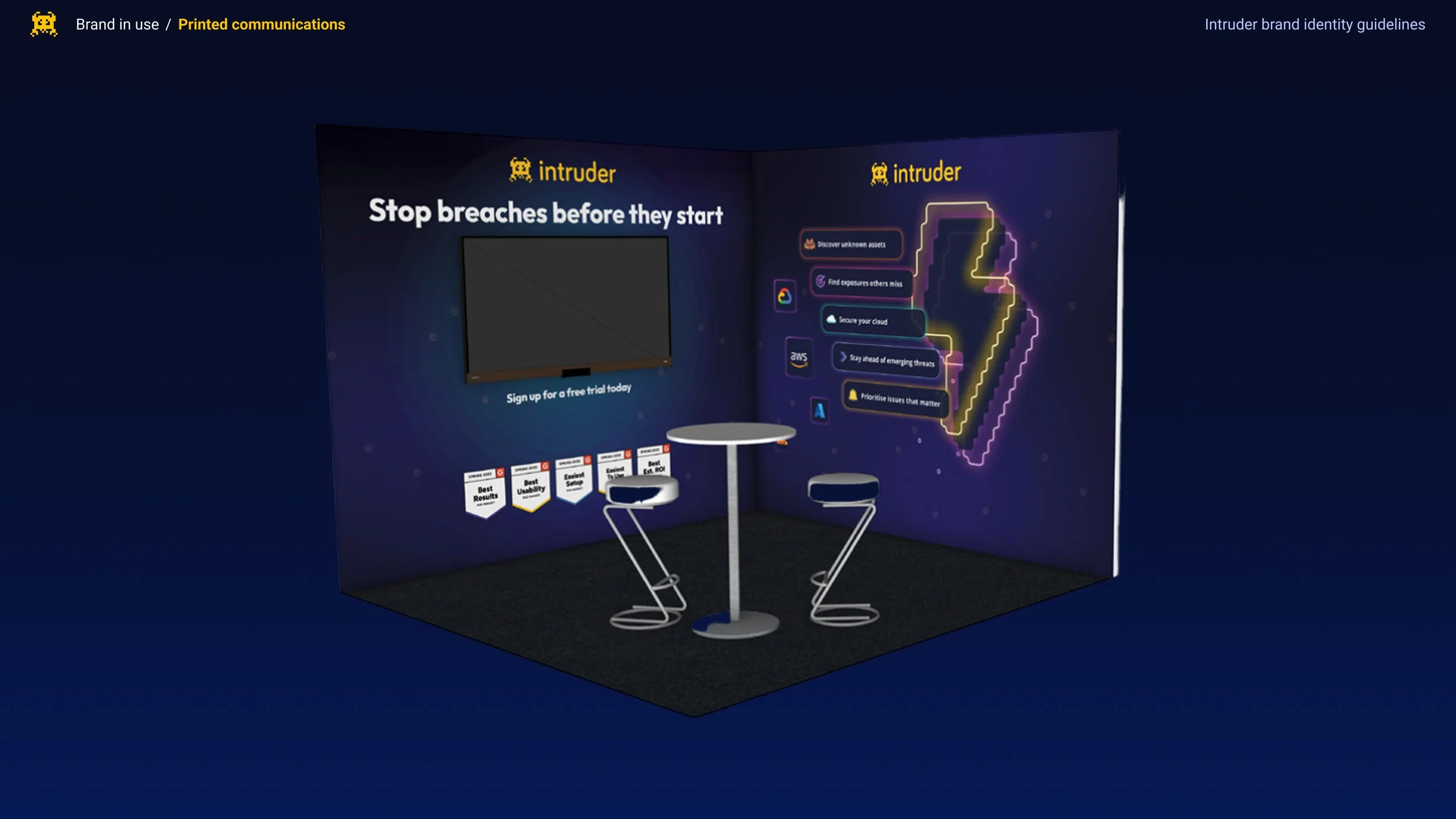 Booth display promoting cybersecurity, with a TV screen, neon security icon, and tips for preventing breaches, titled 'Stop breaches before they start.'