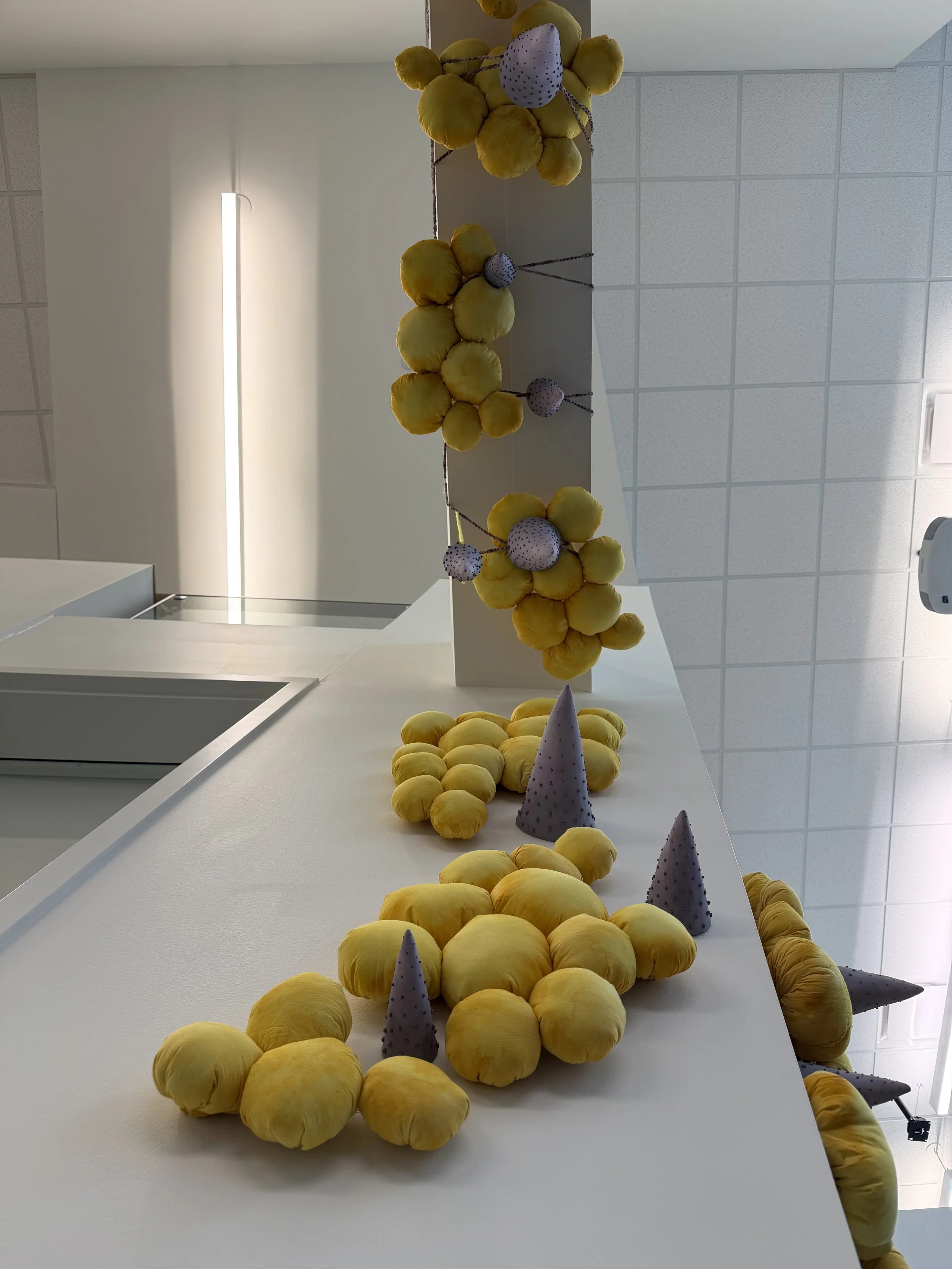 Synaesthetic: Do You Feel What I Feel 
2025 
72" x 108" x 12"
fabric, poly fill, dye, ceramic, slip, underglaze, yarn