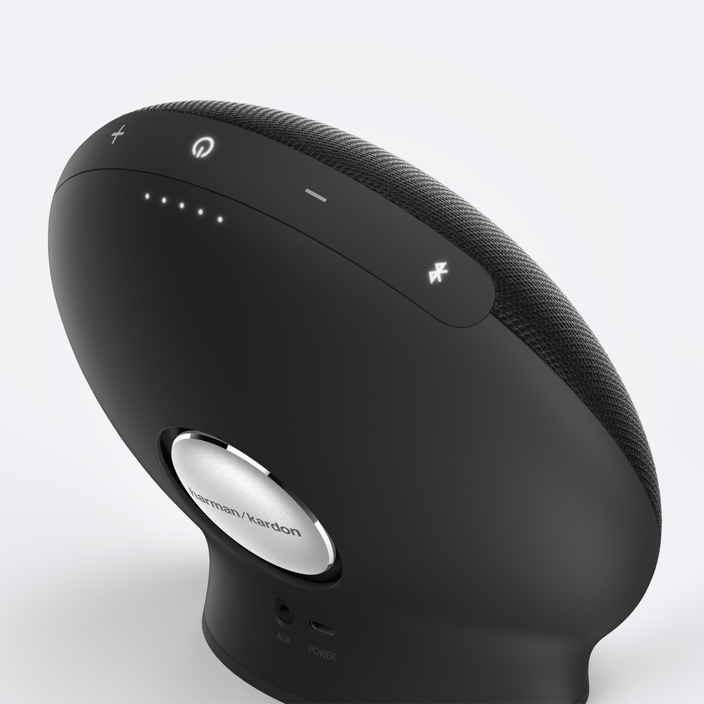 Harman Kardon Onyx Mini speaker highlighting exposed passive radiator