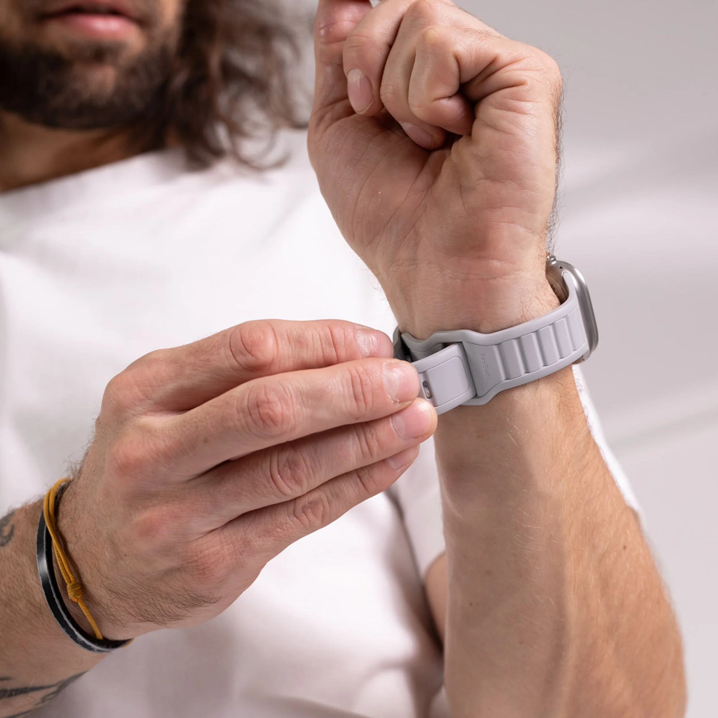 Apple Watch strap being attached to wrist