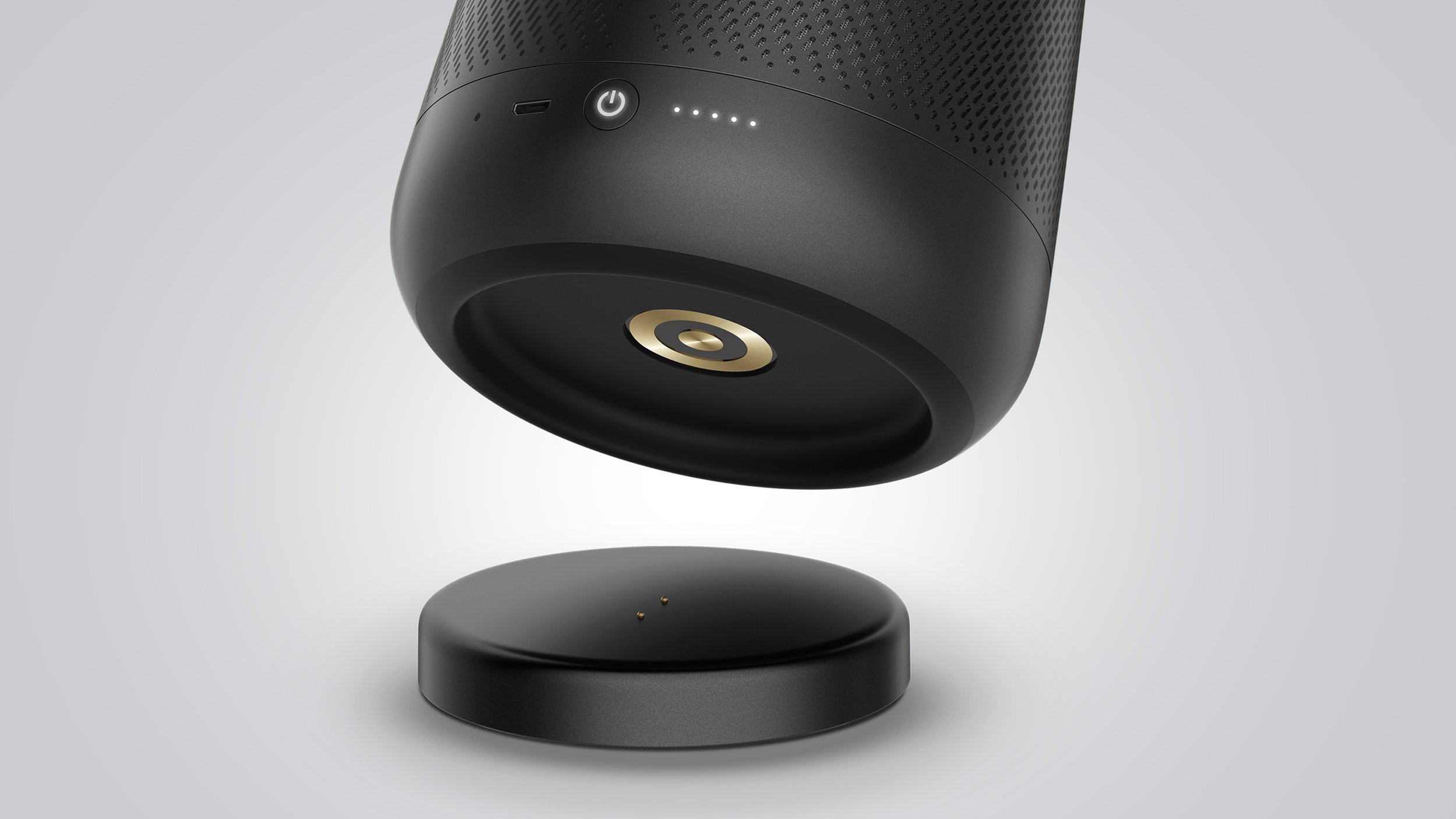 Harman Kardon Allure Portable speaker with charging cradle detail