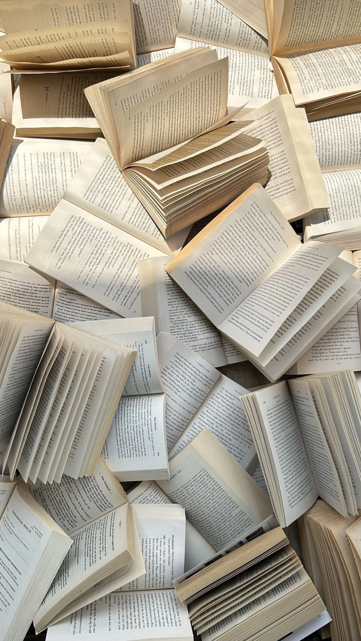 Open books scattered in black and white, copywriting and editorial