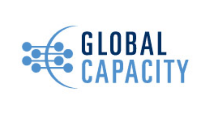 Logo of Global Capacity featuring a stylized globe with interconnected dots and lines in blue, alongside the text 'Global Capacity' in bold blue letters.
