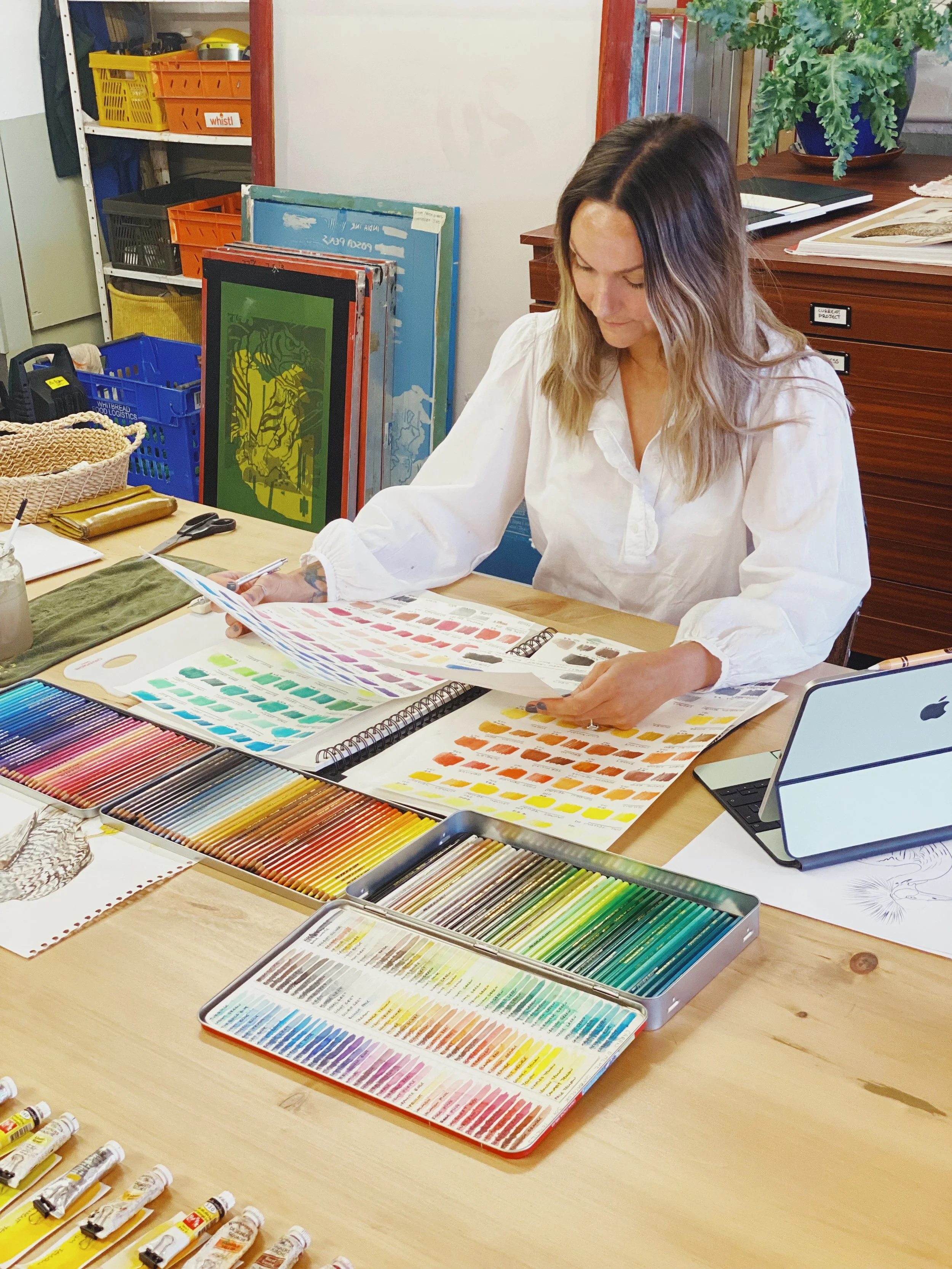 Artist and printmaker Lynsey Jean Henderson working with colour studies in her Edinburgh studio