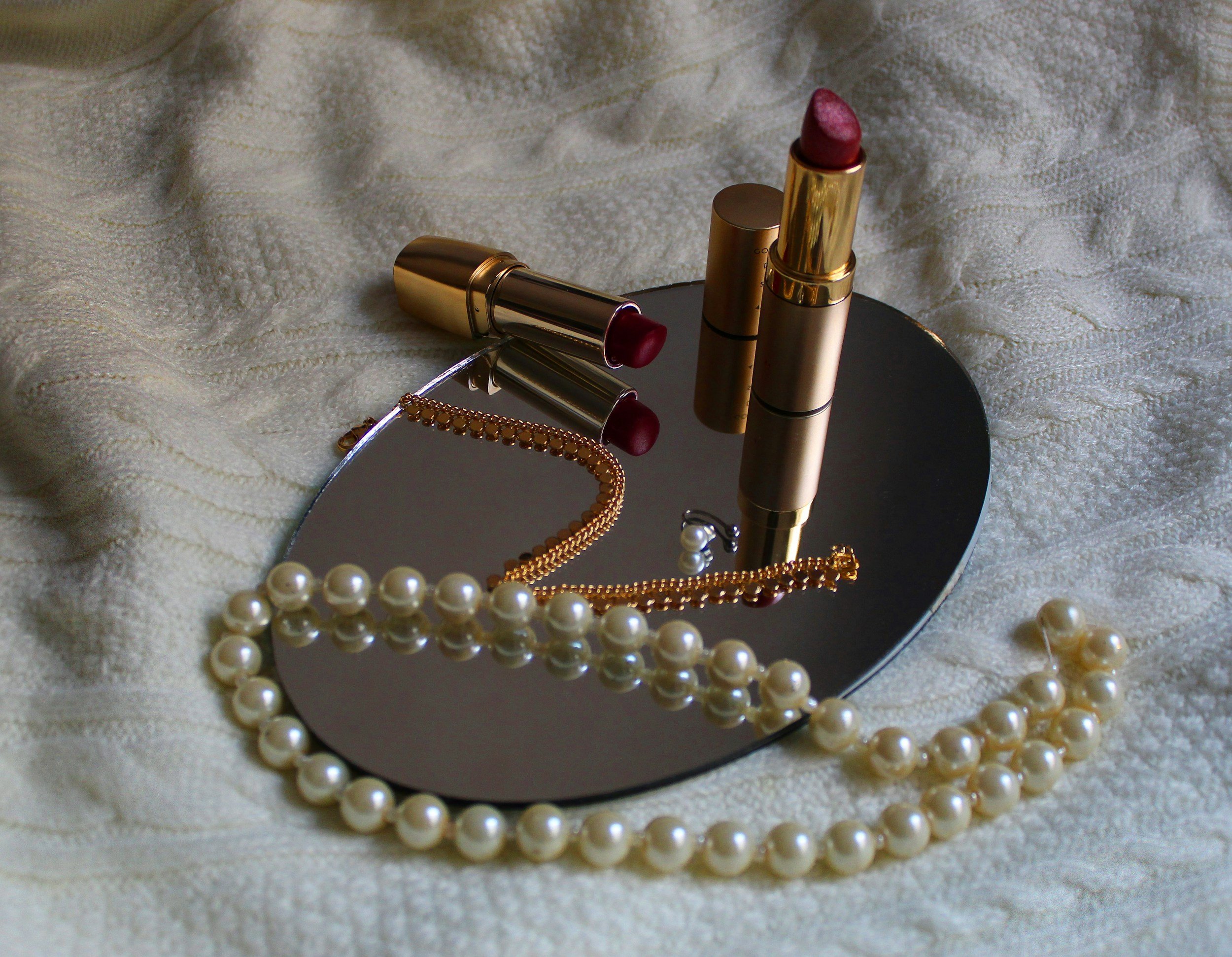 Lipstick and pearl necklace