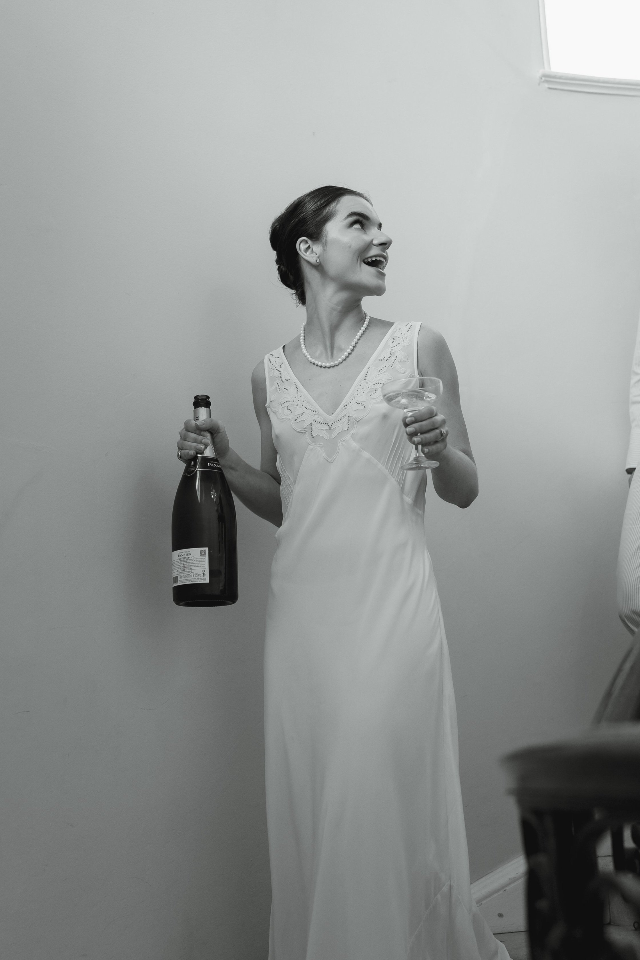 Kathryn holding champagne