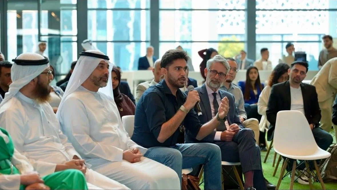 Rehan Arif speaking at a business event in Sharjah, UAE