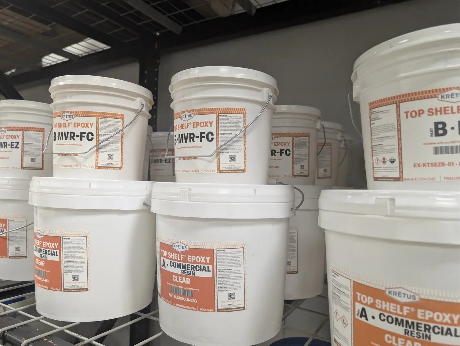 Kretus 3-gallon epoxy kits on the shelf at Empire Coating Solutions in Corona, CA