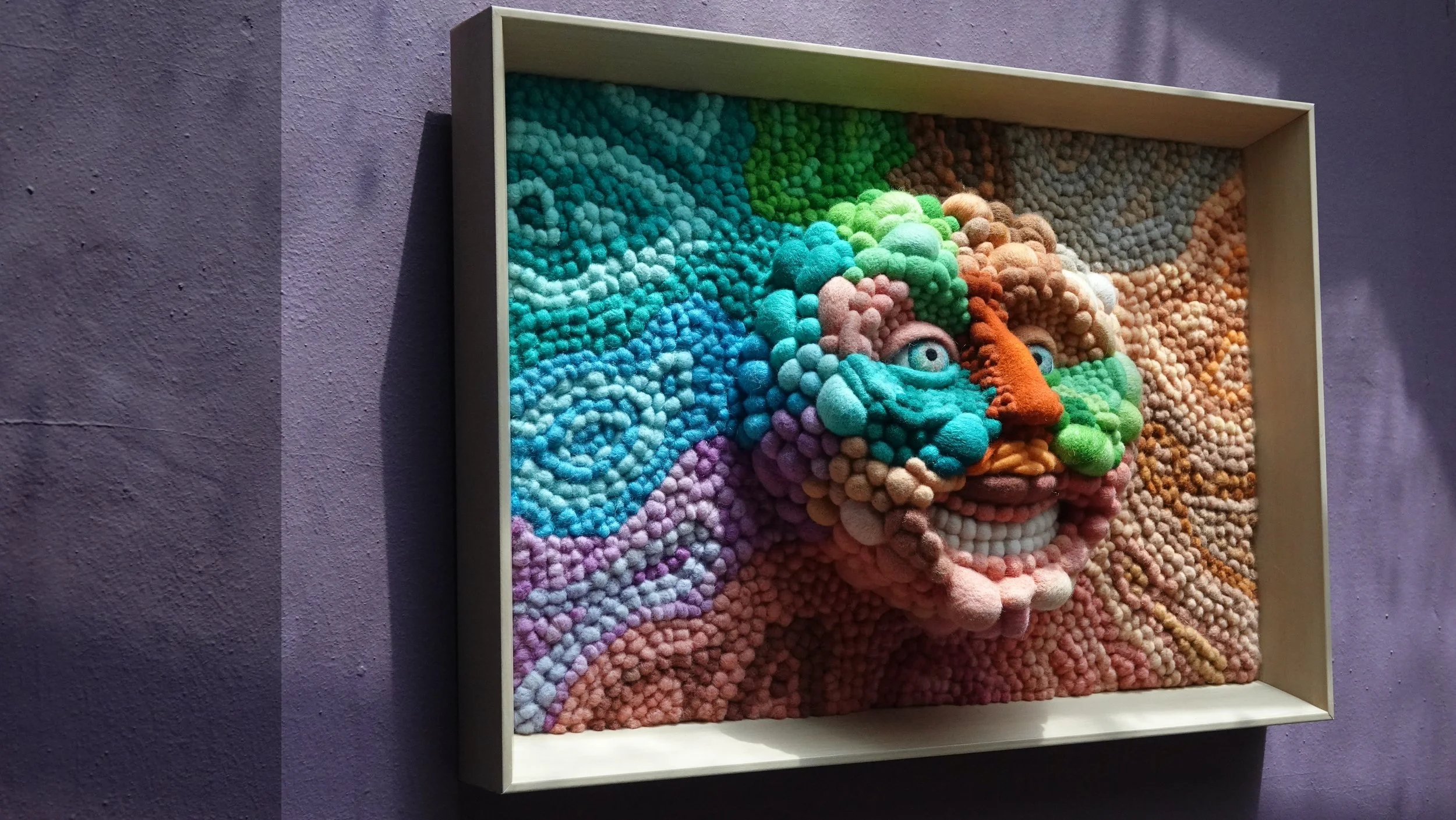 Abstract colorful needle felt face artwork