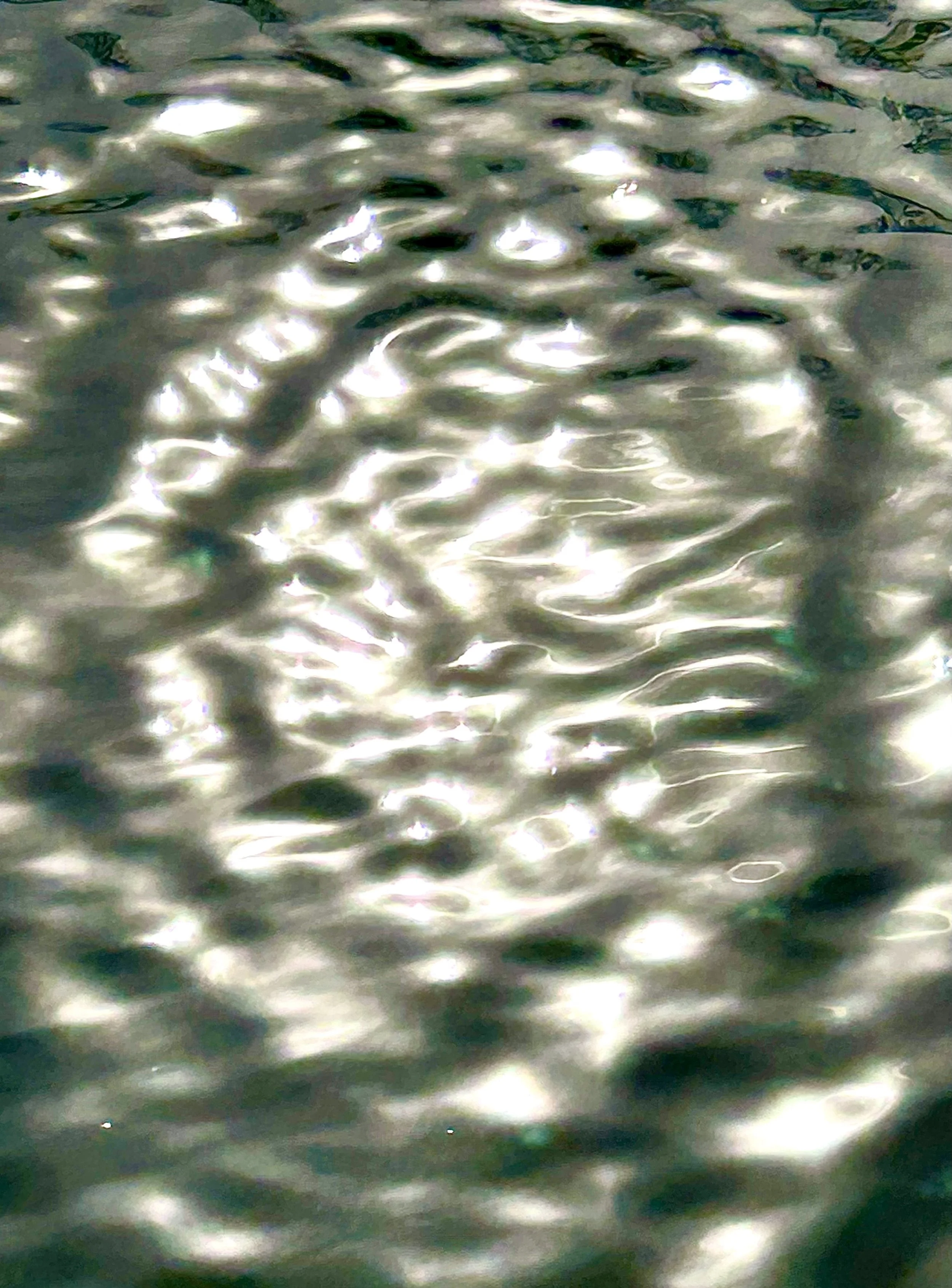 Sunlight dancing on backyard water creating a sparkling, glittering effect that inspired a faith-based painting about heaven touching earth